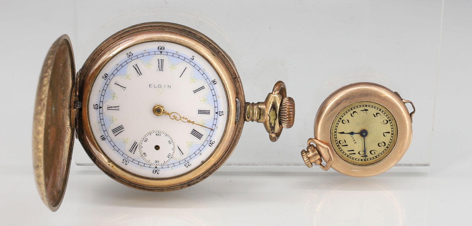 (2) ELGIN WATCHES: CLOSED FACE GOLD FILLED WITH ENAMEL DIAL #13432268 (7) JEWELS AND SMALL WRIST WATCH #25579113 1 1/4" X 7/8" PLEASE READ CAREFULLY - SINCE THIS IS A JEWELRY AND COIN SALE PLEASE NOTE. ITEMS MUST
