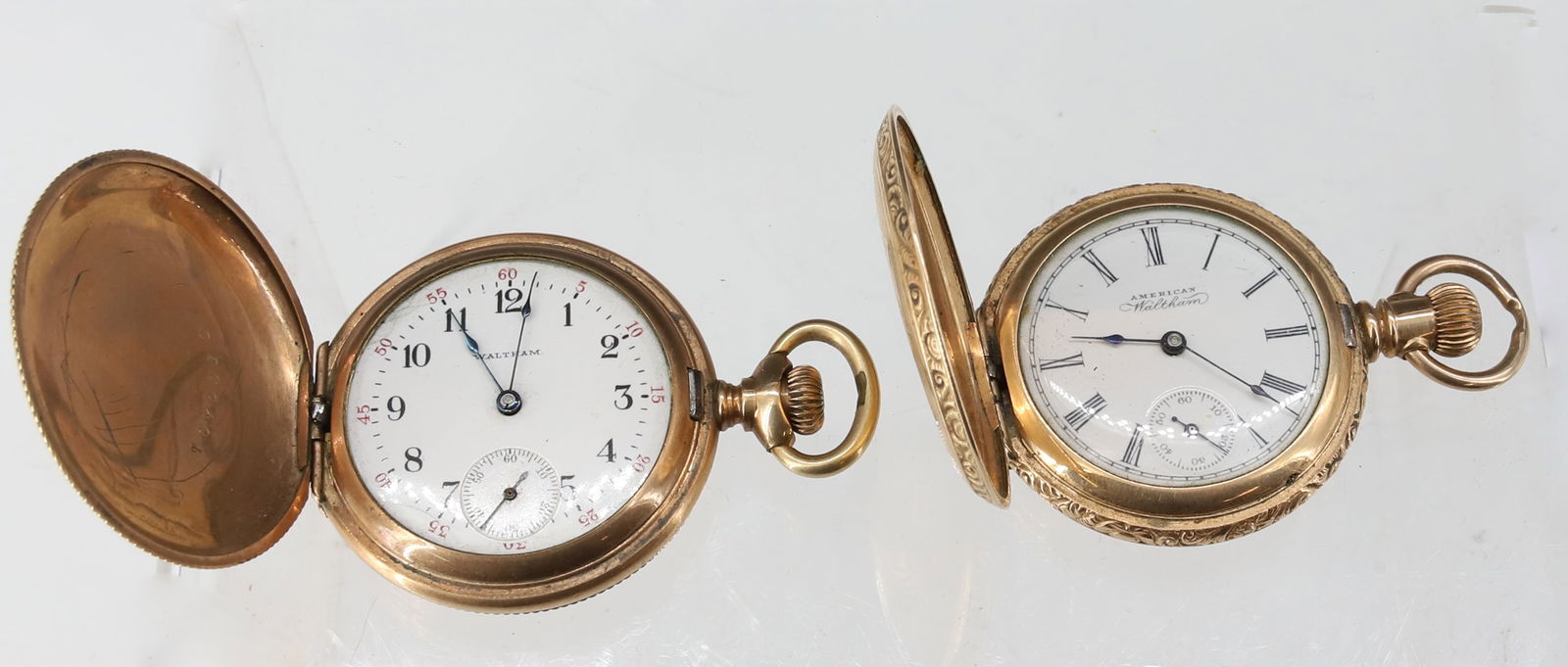 (2) WALTHAM POCKET WATCHES: GOLD FILLED CASE #10910587 WITH SECOND HAND "AMERICAN WALTHAM", #6276014 WITH SECOND HAND ORNATE CASE WITH BIRD MOTIF BOTH WATCHES 2" X 1 3/8" PLEASE READ CAREFULLY - SINCE THIS IS A JEWELRY AND COIN