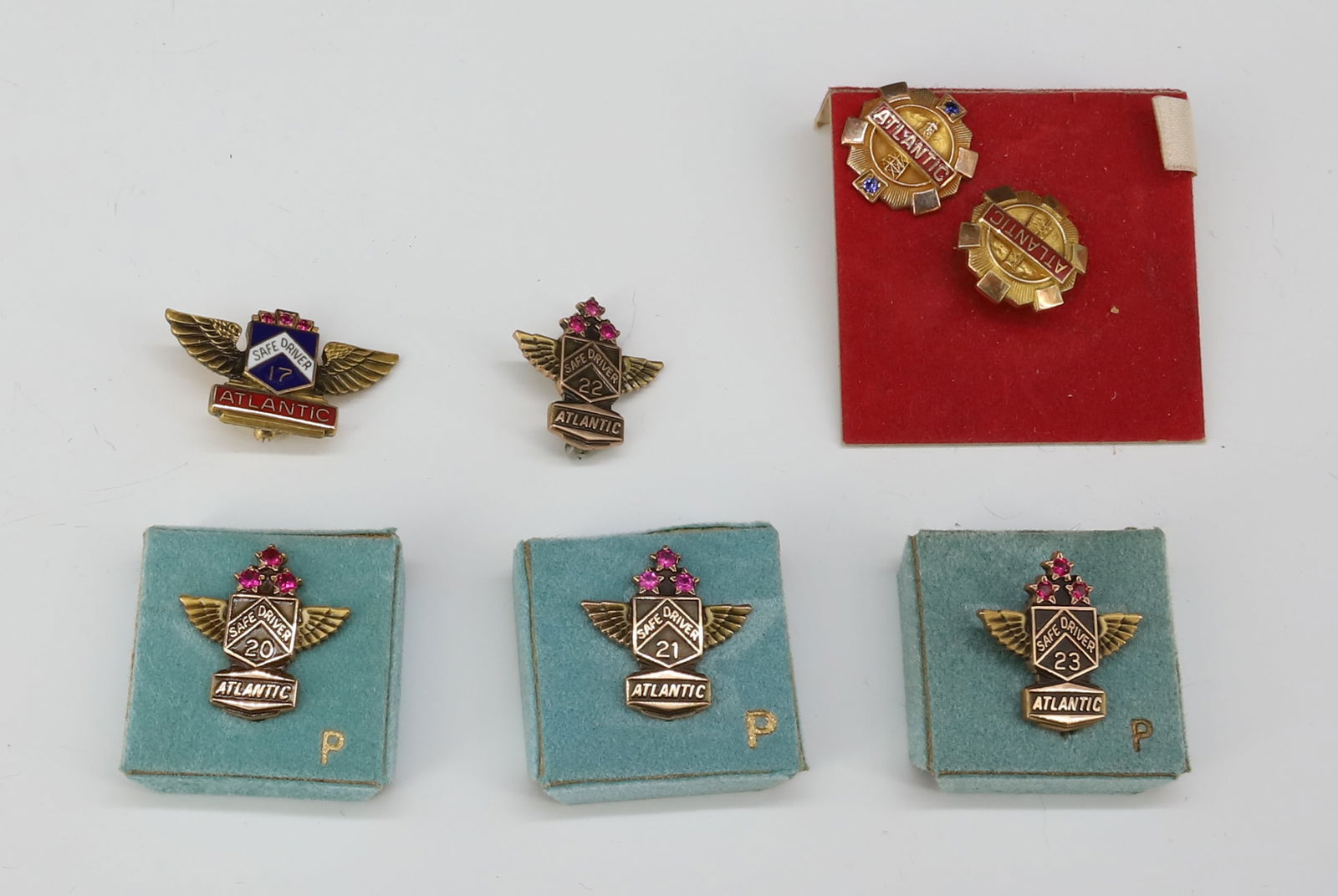 (7) 10K ATLANTIC OIL/GAS SERVICE PINS: SAFE DRIVER SERVICE PINS TOTAL WEIGHT 11.2 DWT 3/4" DIA PLEASE READ CAREFULLY - SINCE THIS IS A JEWELRY AND COIN SALE PLEASE NOTE. ITEMS MUST BE PAID FOR THROUGH LIVE AUCTIONEERS OR WITH CASH