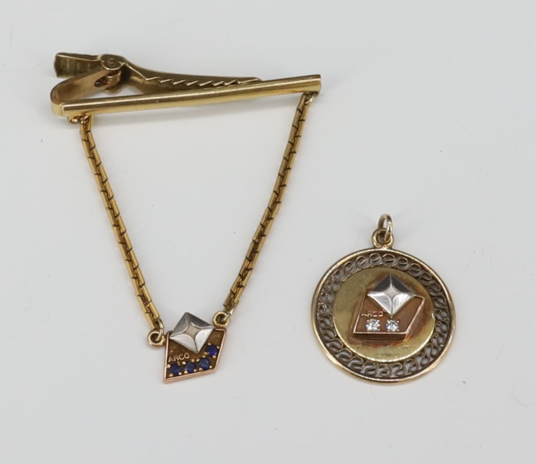 (2) 10K ARCO SERVICE PINS: CHARM WITH SAPPHIRES AND GOLD FILLED TIE CLASP, 10K CHARM MOUNTED TO GOLD FILLED BACK APPROXIMATELY 2 DWT PLEASE READ CAREFULLY - SINCE THIS IS A JEWELRY AND COIN SALE PLEASE NOTE. ITEMS MUST BE