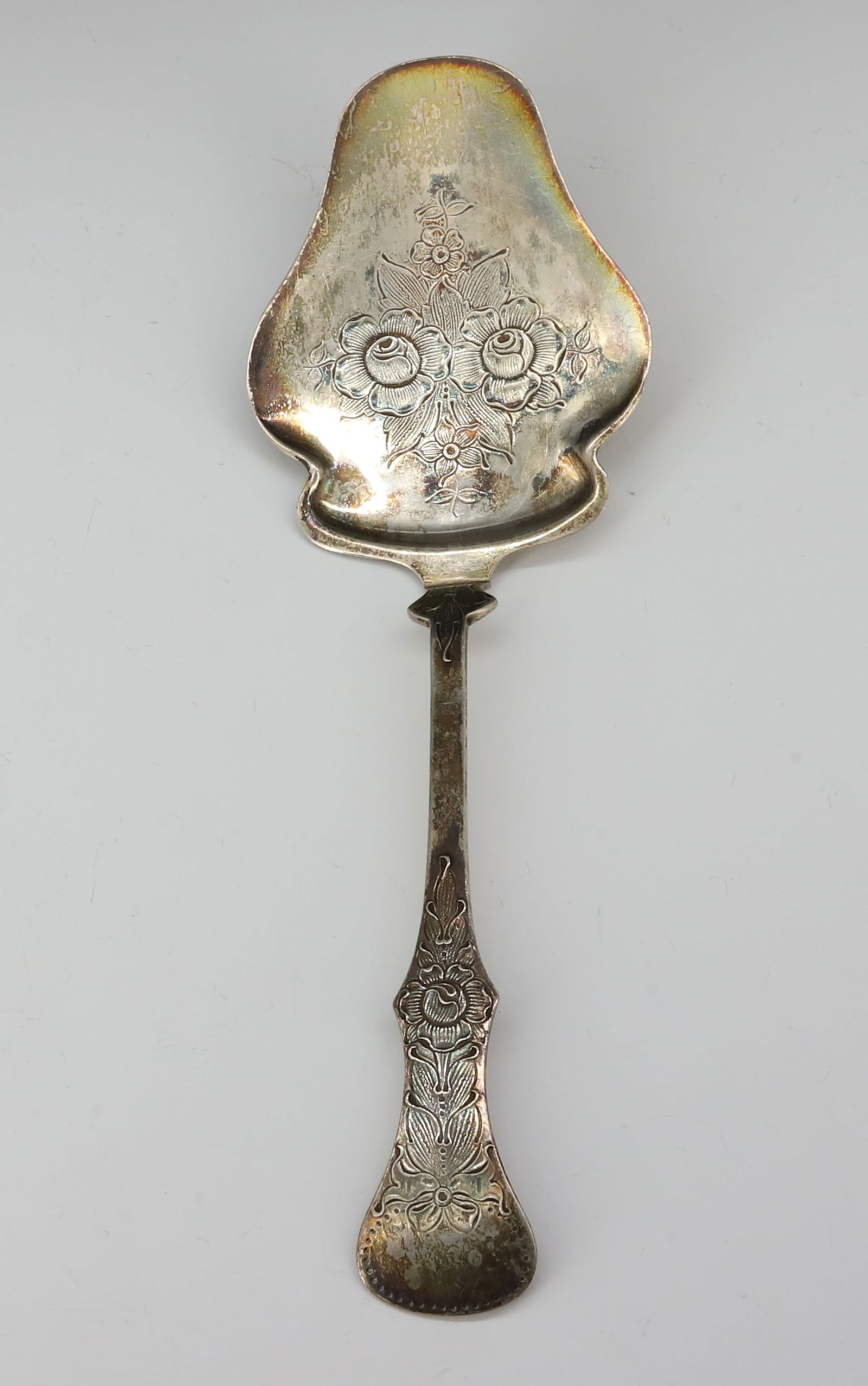 835 SILVER NORWAY PASTRY SERVER: FLAT ROSE PATTERN MARKED J.M.H. 830S 9 1/4"L, 2.5 OZT PLEASE READ CAREFULLY - SINCE THIS IS A JEWELRY AND COIN SALE PLEASE NOTE. ITEMS MUST BE PAID FOR THROUGH LIVE AUCTIONEERS OR WITH CASH OR