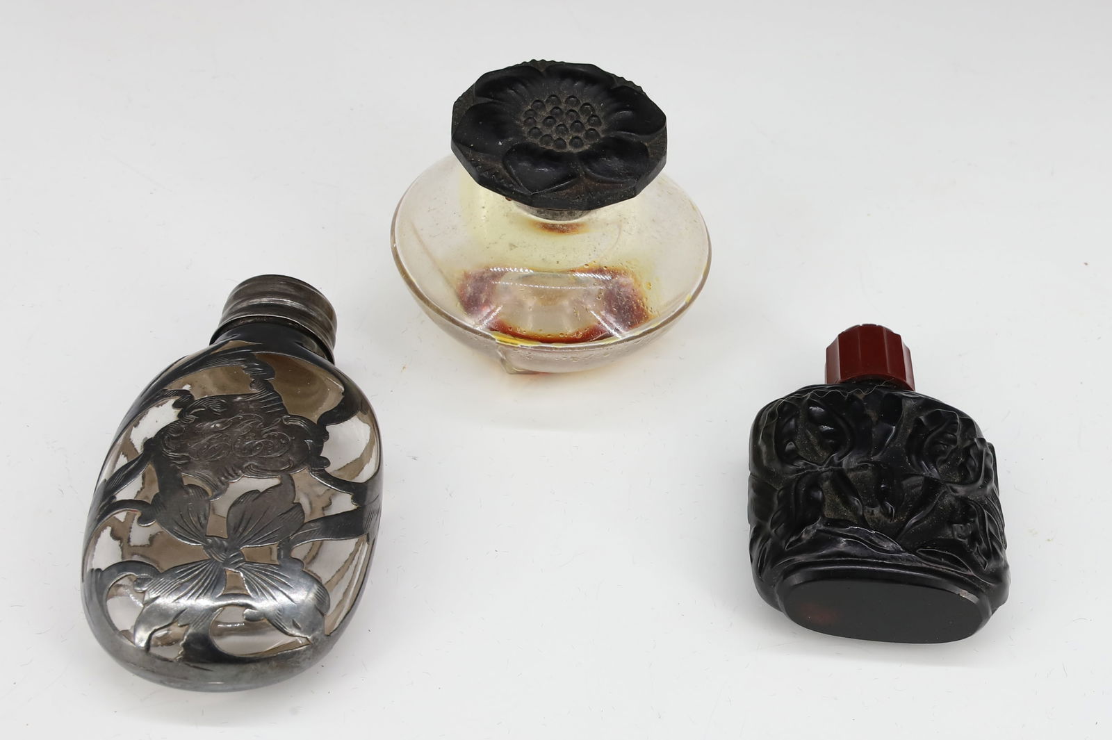 (3) PERFUME BOTTLES: STERLING SILVER OVERLAY SCENT WITH ORIGINAL LID, CZECH SATIN BLACK GLASS PERFUME WITH BAKELITE LID, AND NARCISSE NOIR CARON IN ORIGINAL GIFT BOX 1 3/4" TO 2 3/4" PLEASE READ CAREFULLY - SINCE THIS IS