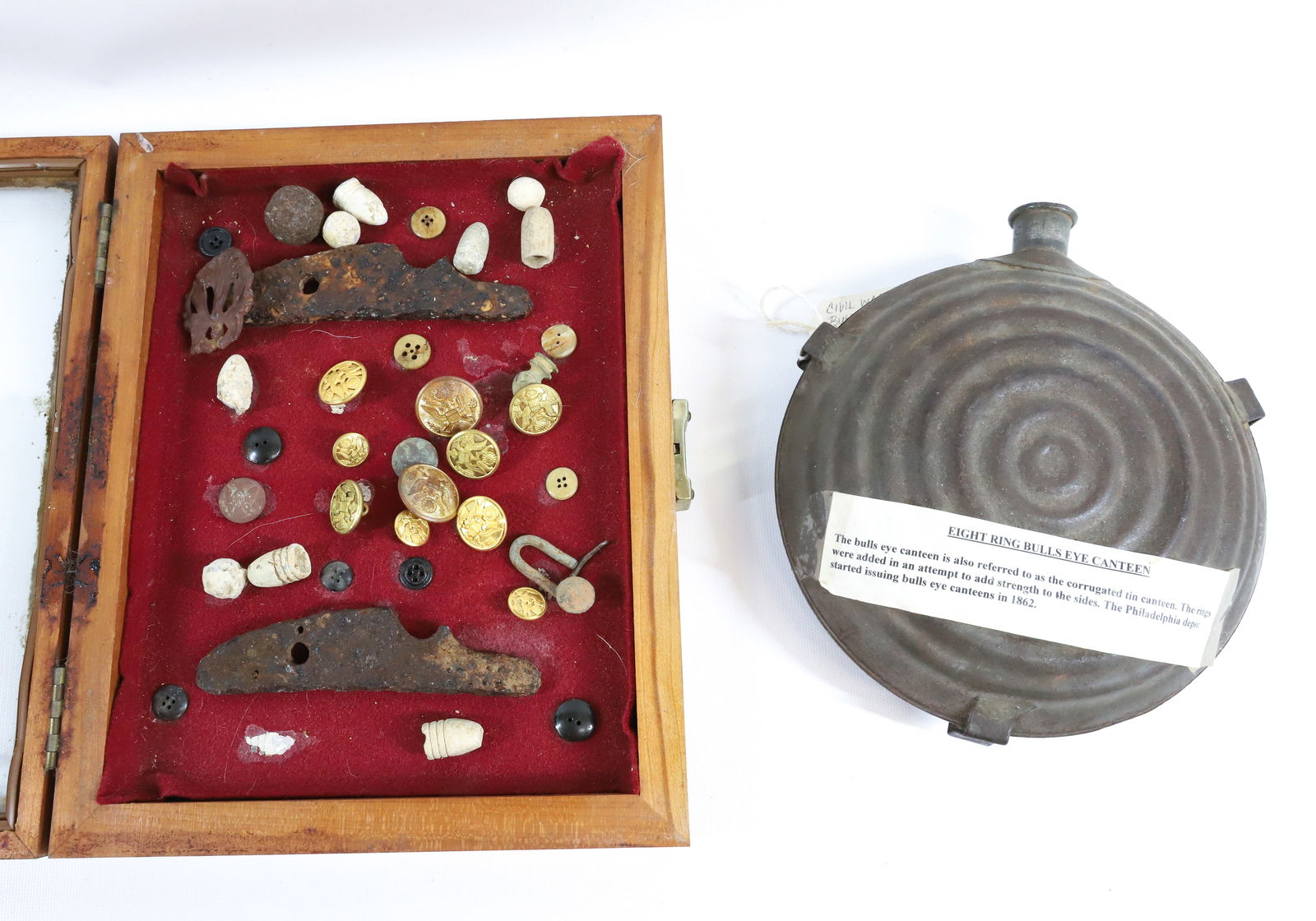 CIVIL WAR CANTEEN AND DIORAMA: EIGHT RING BULLSEYE CANTEEN WITH OLD RELICS, BULLETS, AND BUTTONS IN BOX