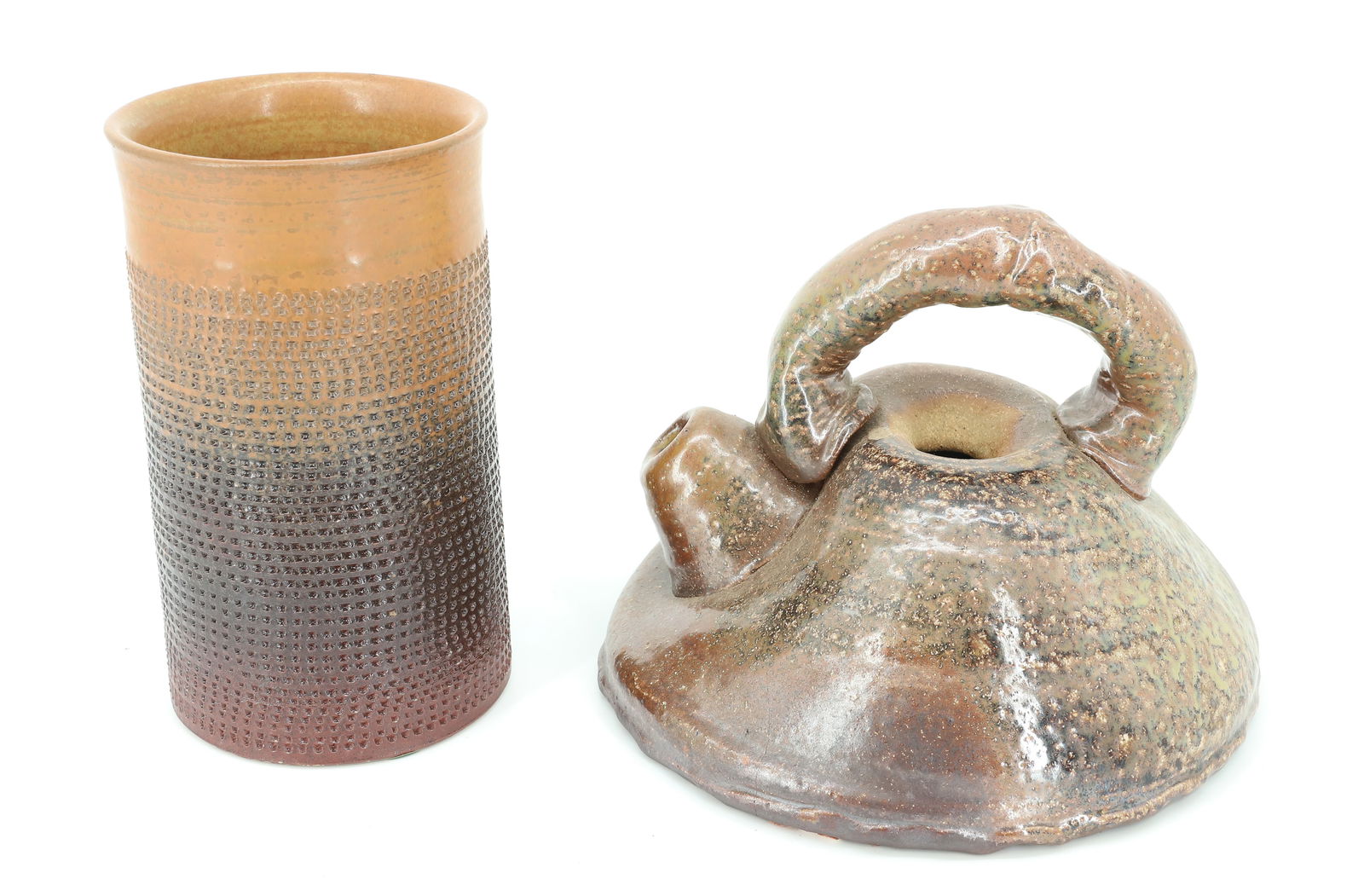 POTTERY TEAPOT AND VASE: SQUATTY, HEAVY TEAPOT WITH APPLIED HANDLE. UNMARKED. 6" X 8 3/8". TEXTURED GRADIENT VASE. MRKD. ON BOTTOM. 7" H. PLEASE READ CAREFULLY - TEMS MUST BE PAID FOR THROUGH LIVE AUCTIONEERS OR WITH