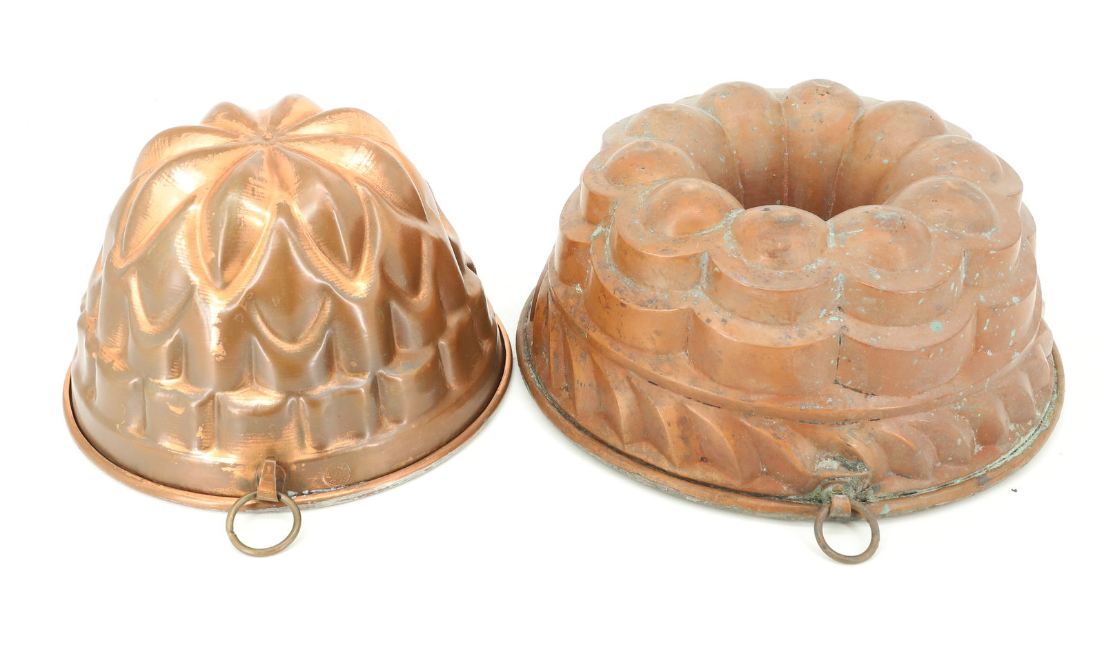 (2) COPPER FOOD MOLDS: SMALLER MRKD. MADE IN ITALY. 4 1/2" X 7 3/4". LARGER IS UNMARKED WITH TINNED INTERIOR. 4" X 9 1/2". PLEASE READ CAREFULLY - TEMS MUST BE PAID FOR THROUGH LIVE AUCTIONEERS OR WITH CASH OR CHECK IN PERS