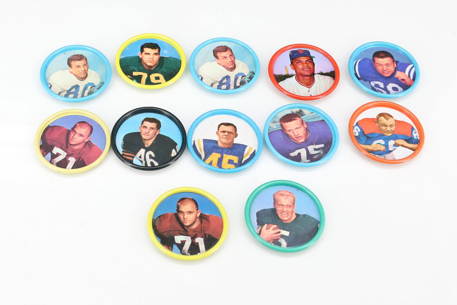 (12) SALADA TEA FOOTBALL COIN: TIN LITHO W/ STATS ON BACK. PLEASE READ CAREFULLY - TEMS MUST BE PAID FOR THROUGH LIVE AUCTIONEERS OR WITH CASH OR CHECK IN PERSON - Terms for Purchasing and Shipping of Auction Items. Please