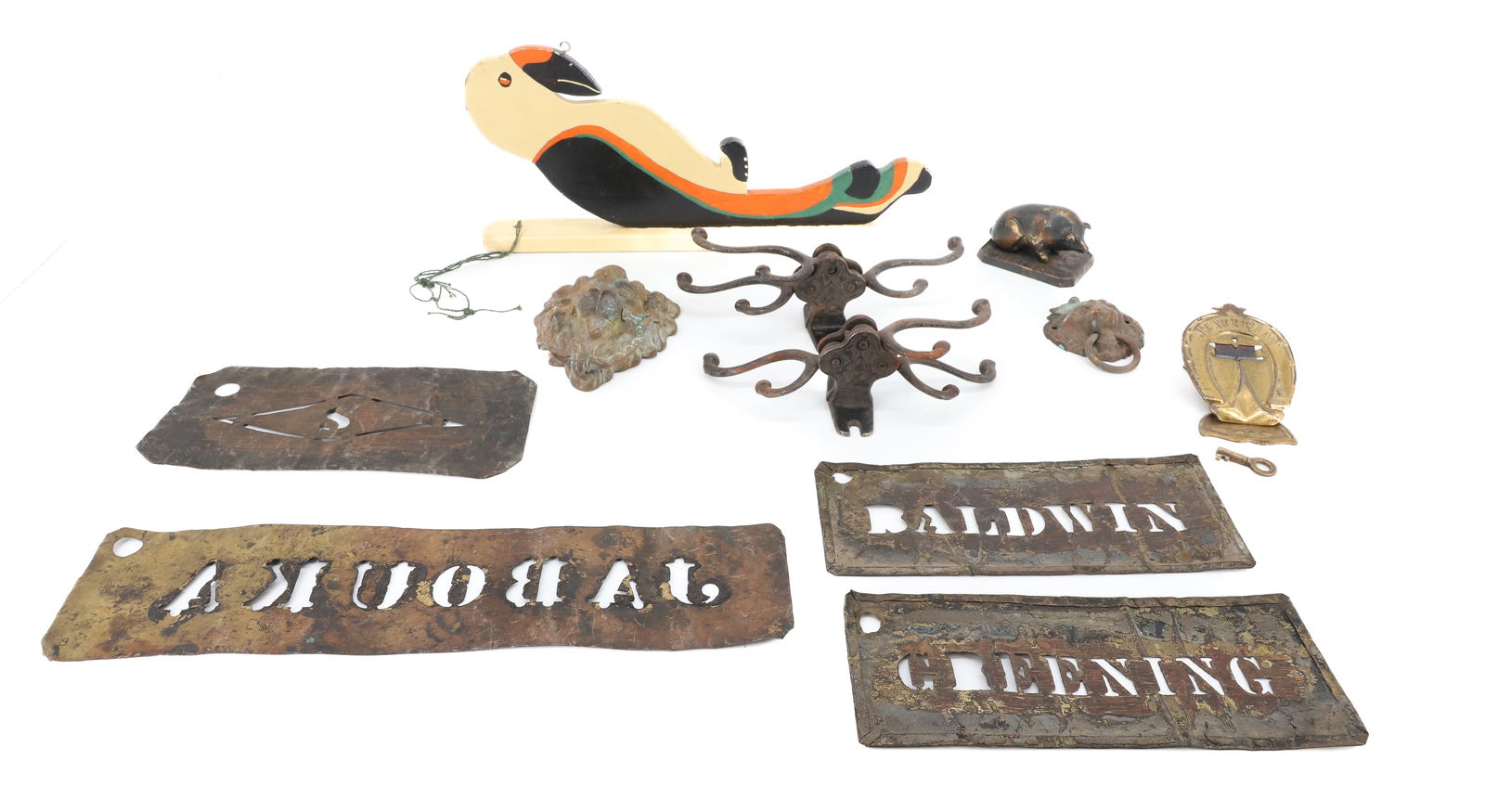 LOT OF VINTAGE SMALLS: INCLUDING: FOLK ART BIRD WALL HANGER 12" L., FOUR BRASS STENCILS, IRON HOOKS, PAINTED BRASS PIG PAPERWEIGHT "THOMAS, 1854-1904", LION HEAD KNOCKER AND MORE. PLEASE READ CAREFULLY - TEMS MUST BE