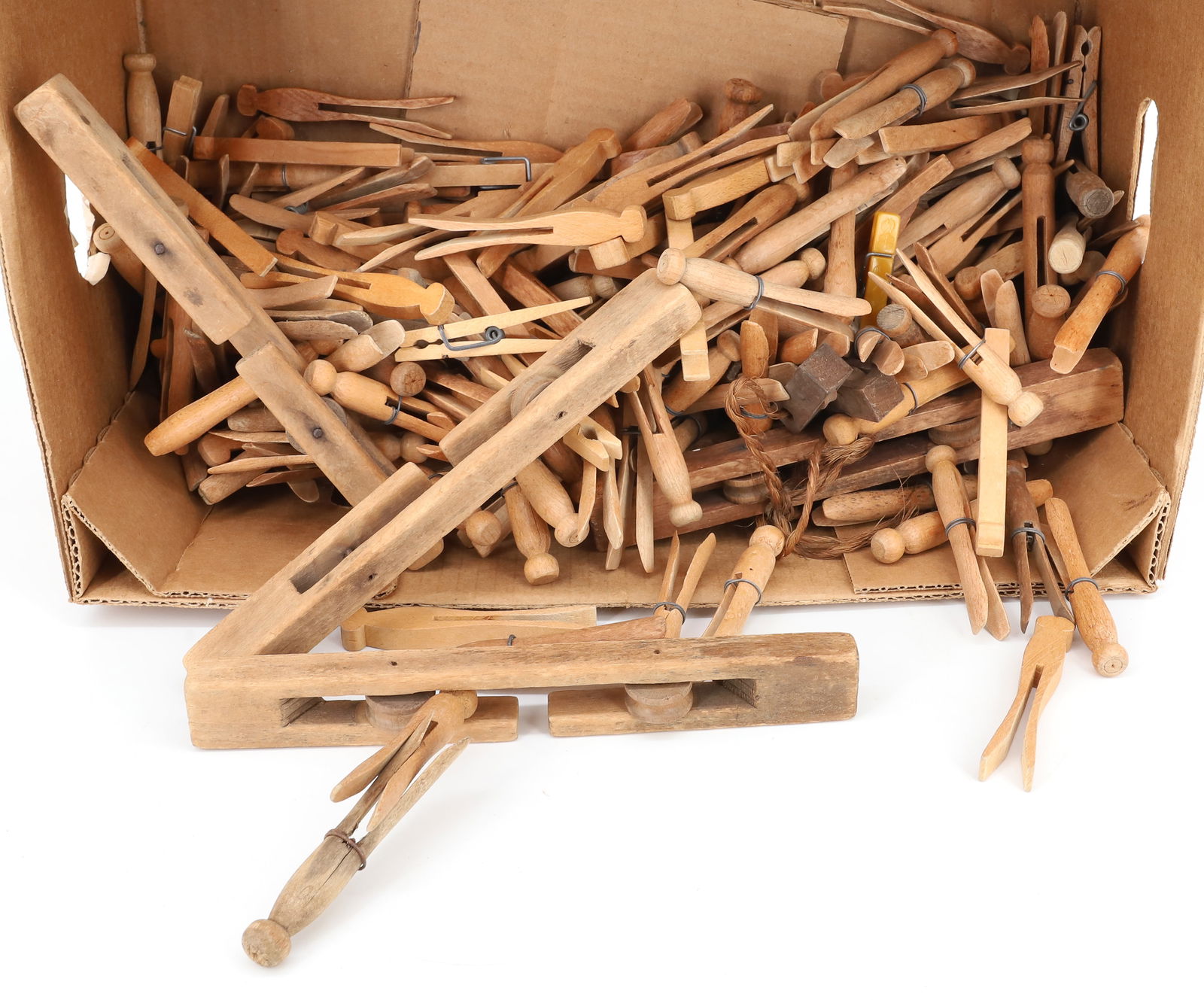 LARGE LOT OF WOODEN CLOTHESPINS: VARIETY OF PIN STYLES AND SIZES. PLEASE READ CAREFULLY - TEMS MUST BE PAID FOR THROUGH LIVE AUCTIONEERS OR WITH CASH OR CHECK IN PERSON - Terms for Purchasing and Shipping of Auction Items.