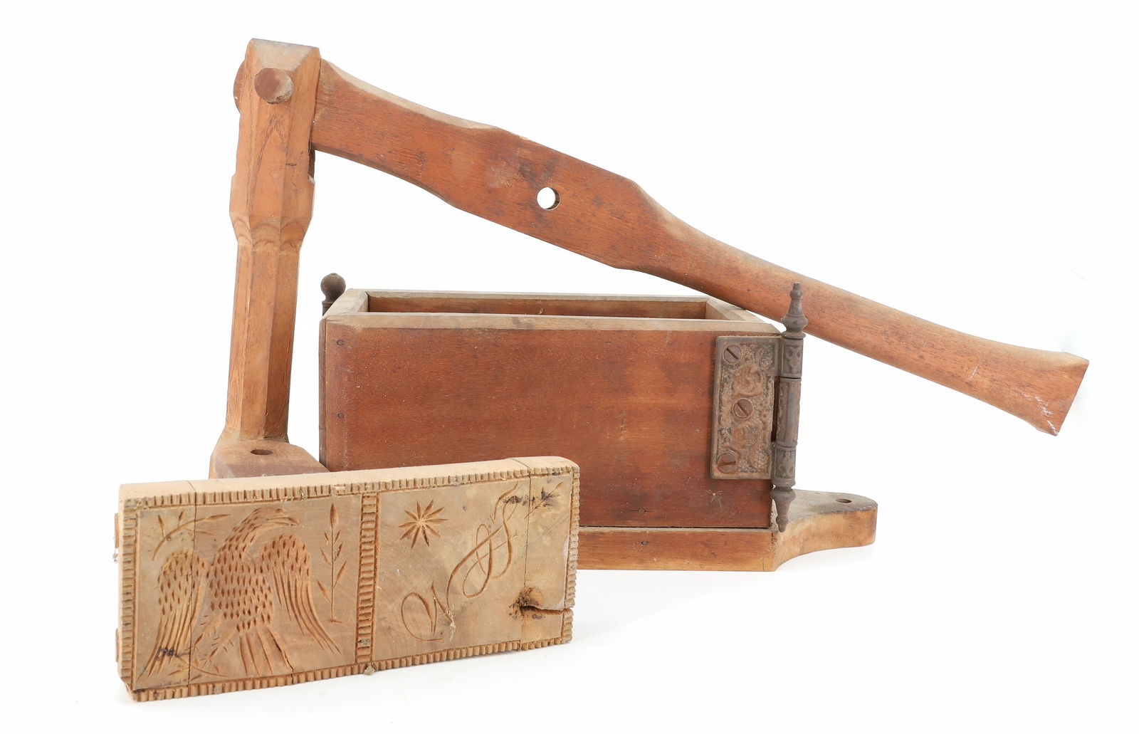 UNUSUAL WOODEN BUTTER PRESS / STAMP: CARVED EAGLE / INITIALS ON STAMP. WOOD AND IRON HINGE CONSTRUCTION. BASE IS 15 1/2" L. PLEASE READ CAREFULLY - TEMS MUST BE PAID FOR THROUGH LIVE AUCTIONEERS OR WITH CASH OR CHECK IN PERSON - 