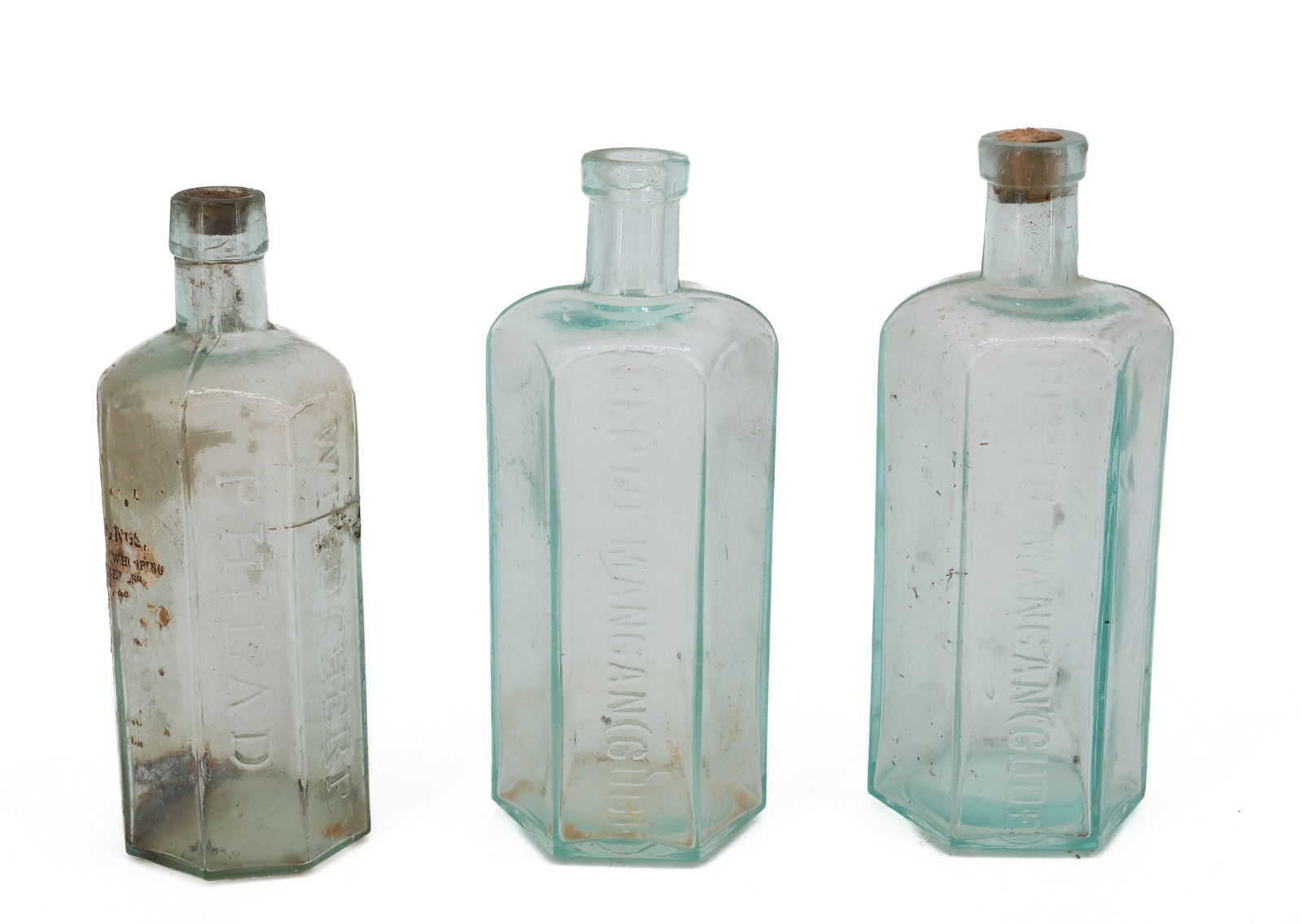 (3) OCTAGONAL BOTTLES: INCLUDING: "DR. WISTAR'S BALSAM OF WILD CHERRY PHILADA" 6 1/2" H. WITH, (2) "PEPTO-MANGAN(GUDE)" 7" H. PLEASE READ CAREFULLY - TEMS MUST BE PAID FOR THROUGH LIVE AUCTIONEERS OR WITH CASH OR