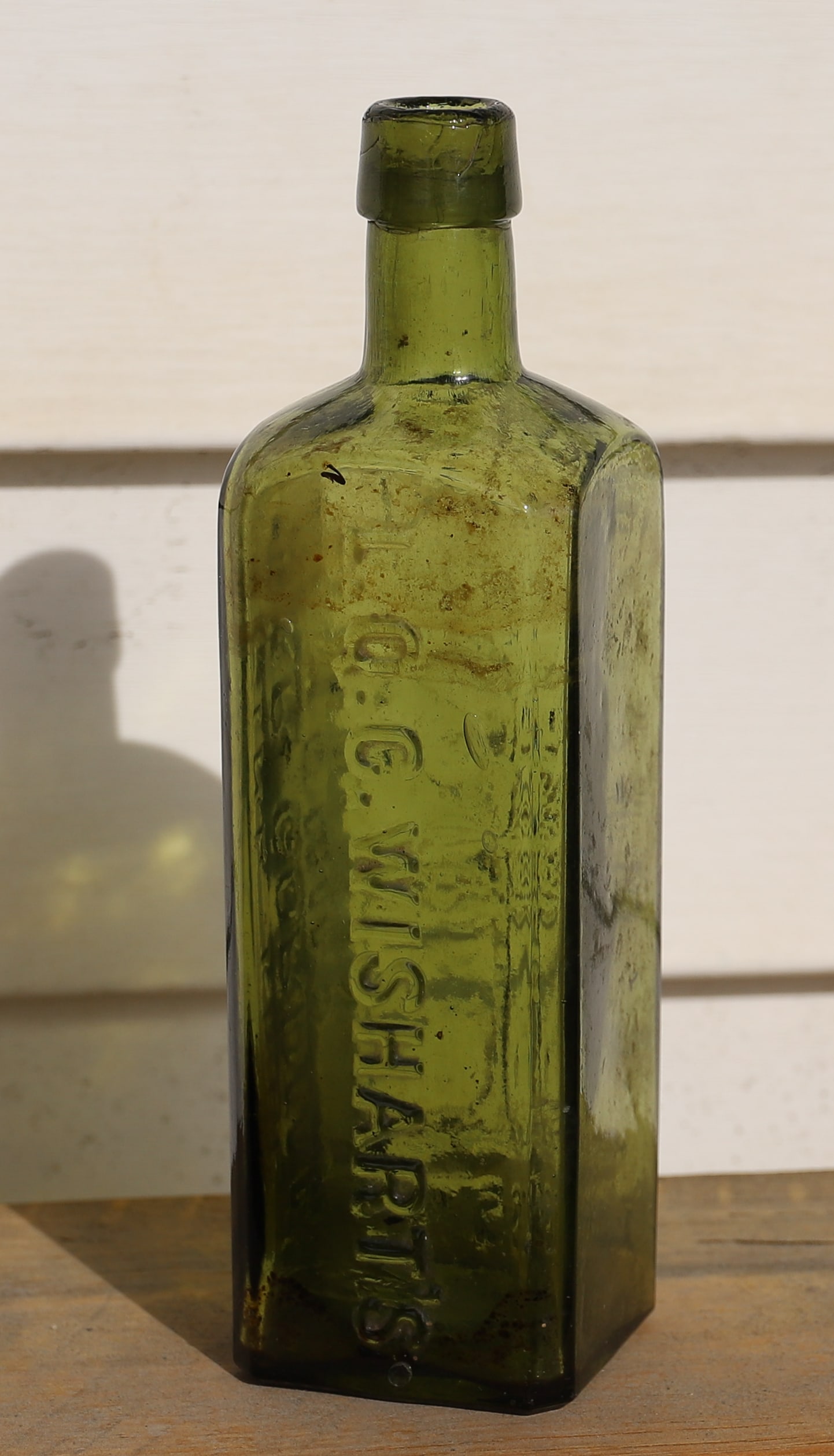 PINE TREE TAR CORDIAL, PHILADELPHIA: GREEN / YELLOW. "L.Q.C. WISHART'S PINE TREE TAR CORDIAL PHILA., PATENT 1859" EMBOSSED ON THREE SIDES. 7 3/4" H. PLEASE READ CAREFULLY - TEMS MUST BE PAID FOR THROUGH LIVE AUCTIONEERS OR WITH