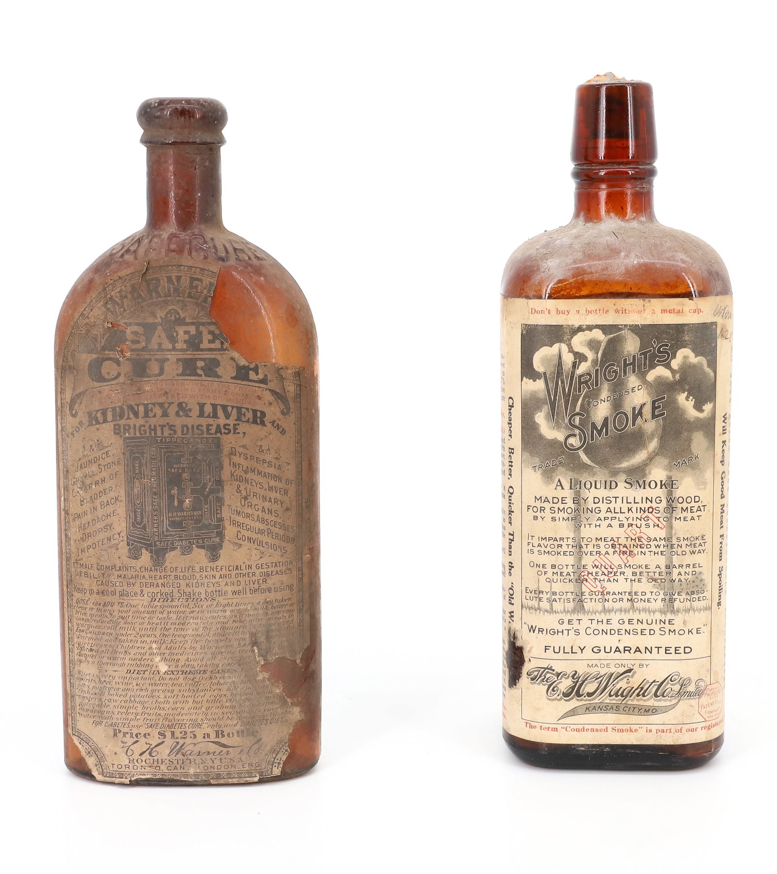 (2) AMBER BOTTLES, WARNER'S SAFE CURE: WARNER'S SAFE CURE EMBOSSED AT TOP WITH ORIGINAL PAPER LABEL. 9 1/2" H. WITH, "WRIGHT'S CONDENSED SMOKE...KANSAS CITY, MO" 9 3/4" H. PLEASE READ CAREFULLY - TEMS MUST BE PAID FOR THROUGH LIVE