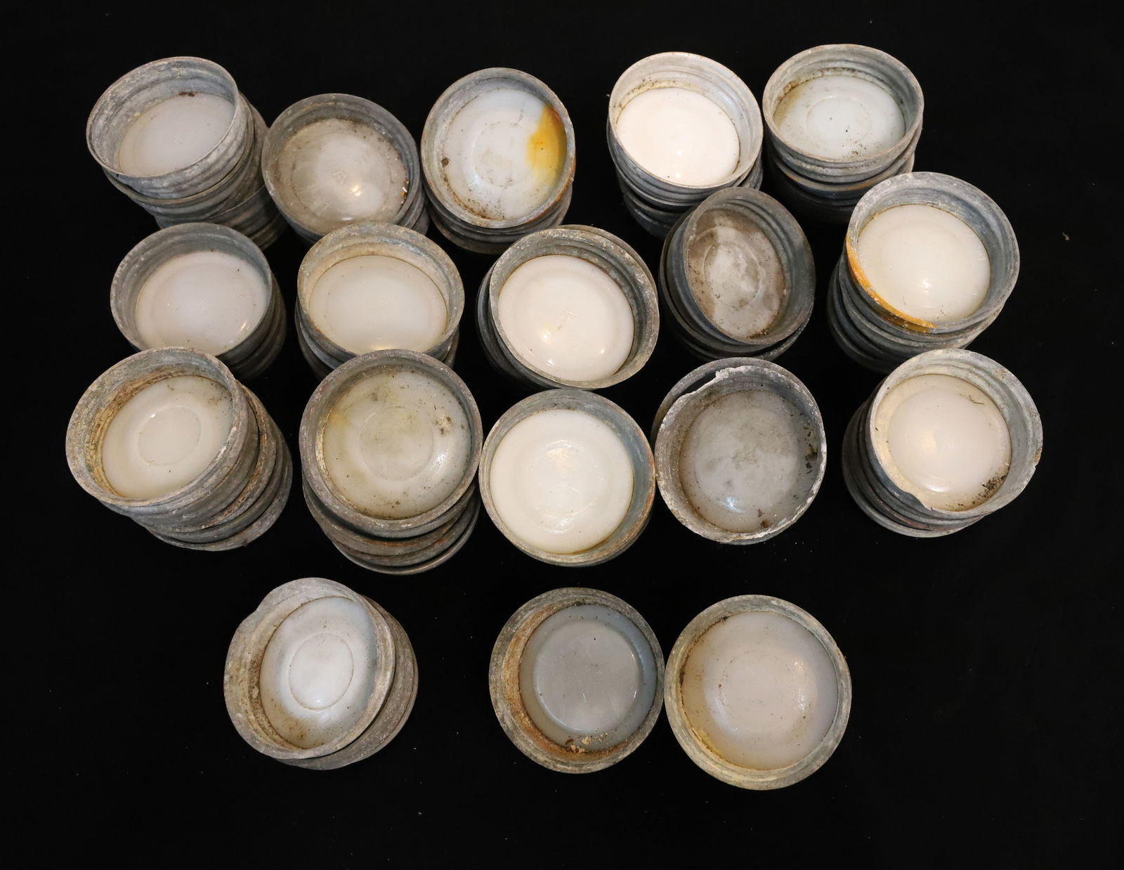 LOT OF ZINC FRUIT JAR LIDS: LARGE LOT OF ZINC LIDS (SOME WITH PORCELAIN INSERTS) 3" D. AT BOTTOM. PLEASE READ CAREFULLY - TEMS MUST BE PAID FOR THROUGH LIVE AUCTIONEERS OR WITH CASH OR CHECK IN PERSON - Terms for Purchasing