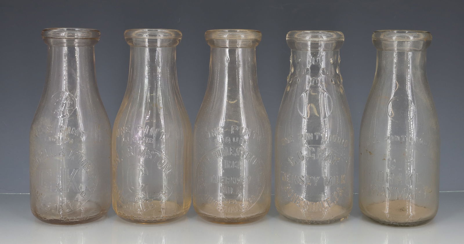 LOT OF HONESDALE, PA MILK BOTTLES: (4) HONESDALE INCLUDING: GAMMELL & KIMBLE. BETHANY HOMESTEAD FARMS. C.C. GRAY JERSEY MILK. H.W. GRIMSTONE. 7 1/4" H. WITH, C.F. DRAKE (WAYMART). PLEASE READ CAREFULLY - TEMS MUST BE PAID FOR