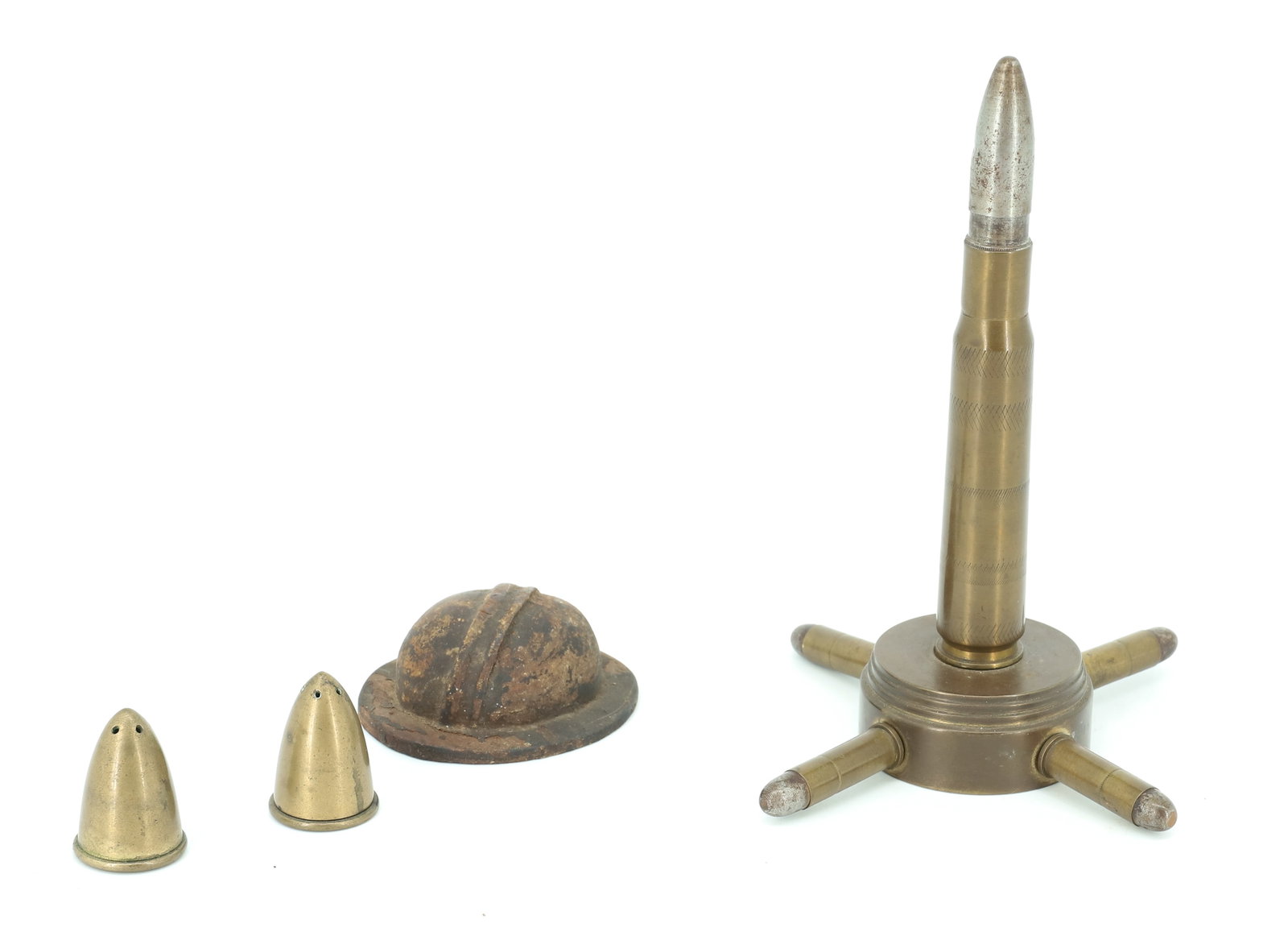 TRENCH ART LIGHTER AND MORE: BRASS TRENCH ART DESKTOP LIGHTER 6 1/2" H., MINIATURE WOODEN HELMET 2 3/4" L. WITH "DIRIGOLD" SALT / PEPPER SHAKERS 1 3/8" H. PLEASE READ CAREFULLY - ITEMS MUST BE PAID FOR THROUGH LIVE