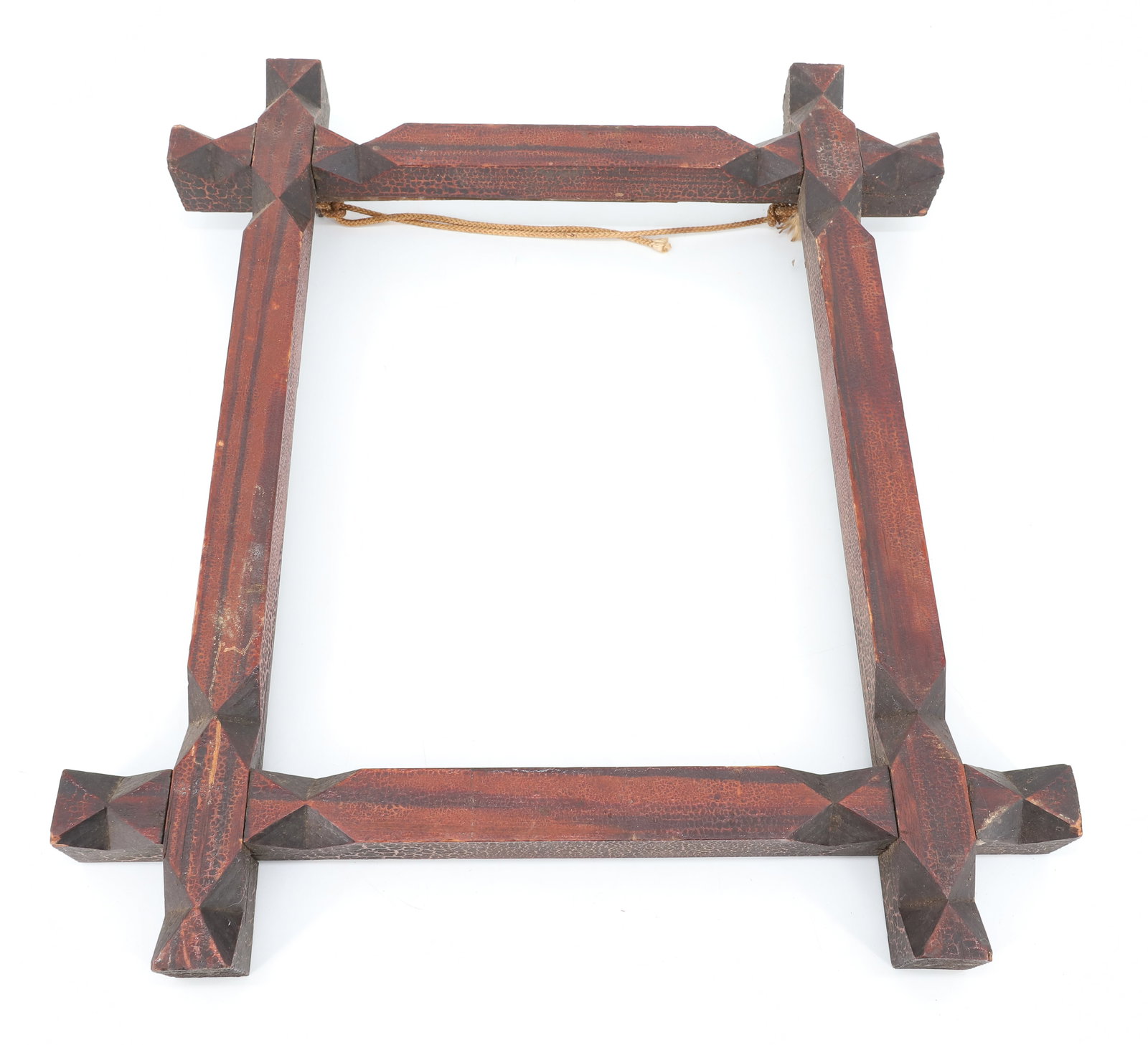 CARVED WOODEN FRAME: FOLK ART FRAME WITH "PAINTED STRIPING" ALLIGATORED SURFACE. 14" X 16". INTERIOR 8 7/8" X 10 7/8". PLEASE READ CAREFULLY - ITEMS MUST BE PAID FOR THROUGH LIVE AUCTIONEERS OR WITH CASH OR CHECK IN PERSO