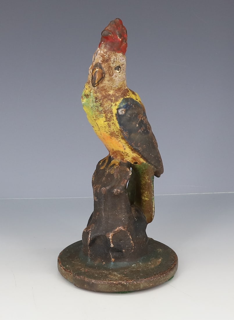 CAST IRON PARROT DOORSTOP: CAST IRON WITH MULTI-COLOR PAINTED SURFACE. 7 1/8" H. PLEASE READ CAREFULLY - ITEMS MUST BE PAID FOR THROUGH LIVE AUCTIONEERS OR WITH CASH OR CHECK IN PERSON - Terms for Purchasing and Shipping of Auc