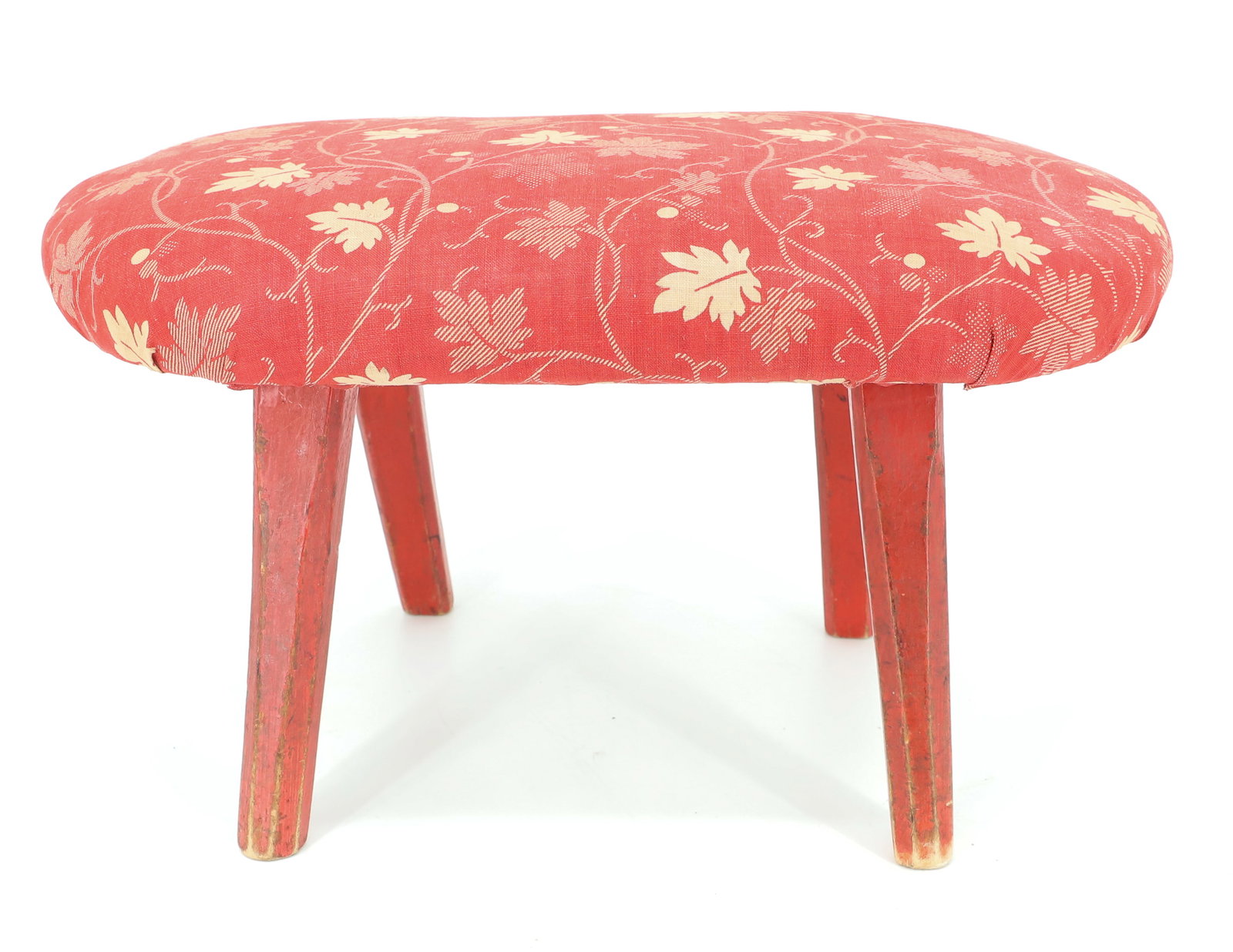 PAINTED / UPHOLSTERED ANTIQUE FOOTSTOOL, CRICKET BENCH: EARLY RED FABRIC ON TOP WITH CARVED AND PAINTED WOODEN LEGS. CARVED INITIALS ON BOTTOM "XN". 7" X 12 1/2" X 8". PLEASE READ CAREFULLY - ITEMS MUST BE PAID FOR THROUGH LIVE AUCTIONEERS OR WITH CASH OR