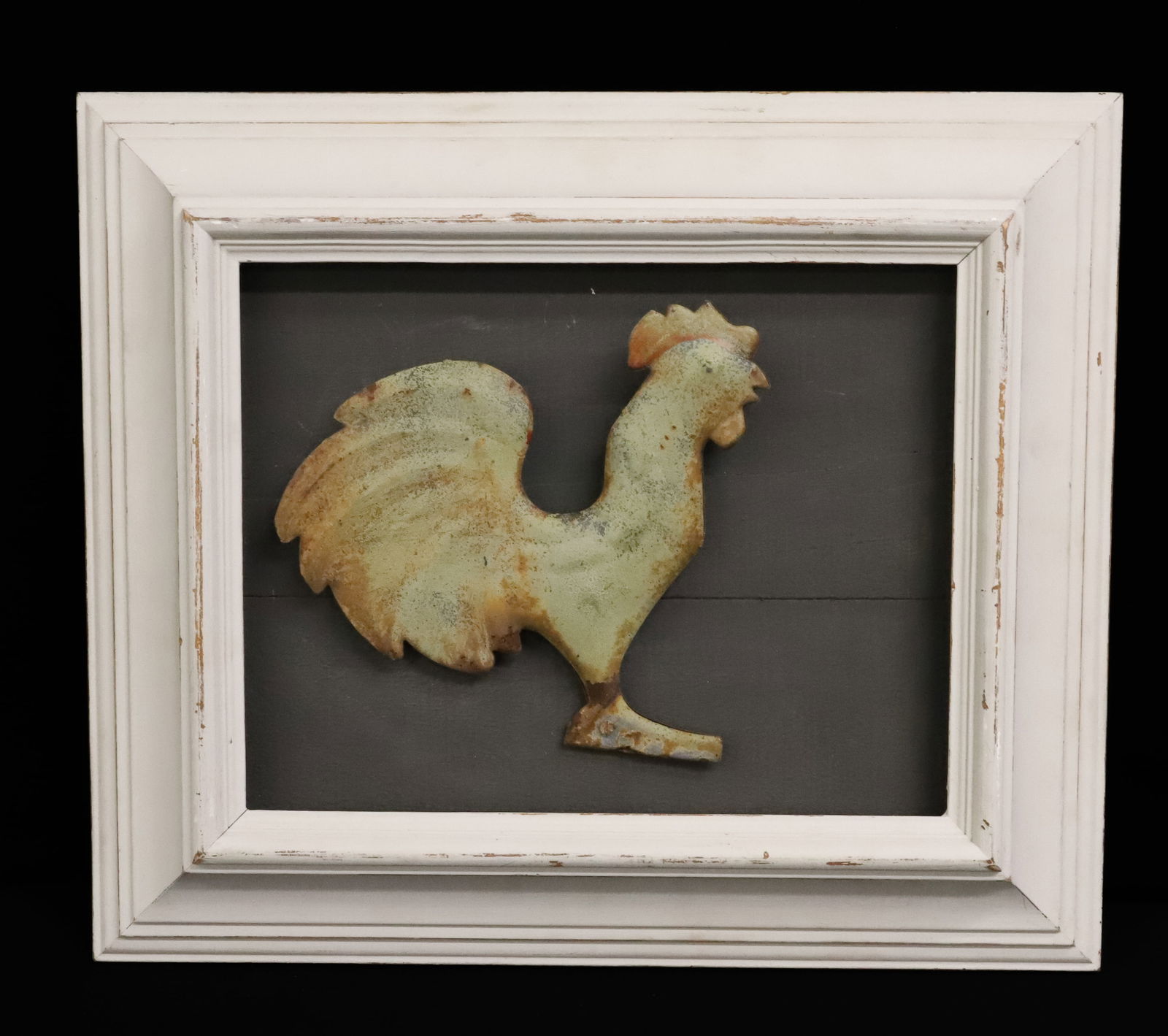 FRAMED FOLK ART ROOSTER: METAL HOLLOW-BODY ROOSTER W/ PAINTED SURFACE. 8 1/2" X 9 1/2" . TOTAL FRAMED SIZE 17 1/4" X 20 1/4". PLEASE READ CAREFULLY - ITEMS MUST BE PAID FOR THROUGH LIVE AUCTIONEERS OR WITH CASH OR CHECK