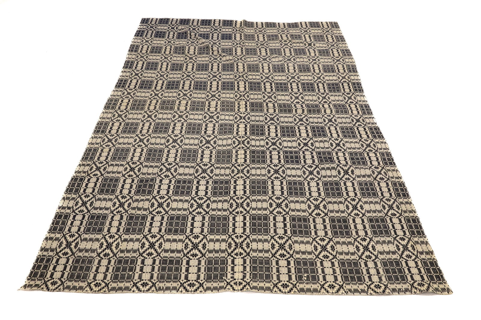 19TH C. NAVY / WHITE WOVEN COVERLET: 95" X 68". FRINGE ON ONE END. PLEASE READ CAREFULLY - ITEMS MUST BE PAID FOR THROUGH LIVE AUCTIONEERS OR WITH CASH OR CHECK IN PERSON - Terms for Purchasing and Shipping of Auction Items. Please