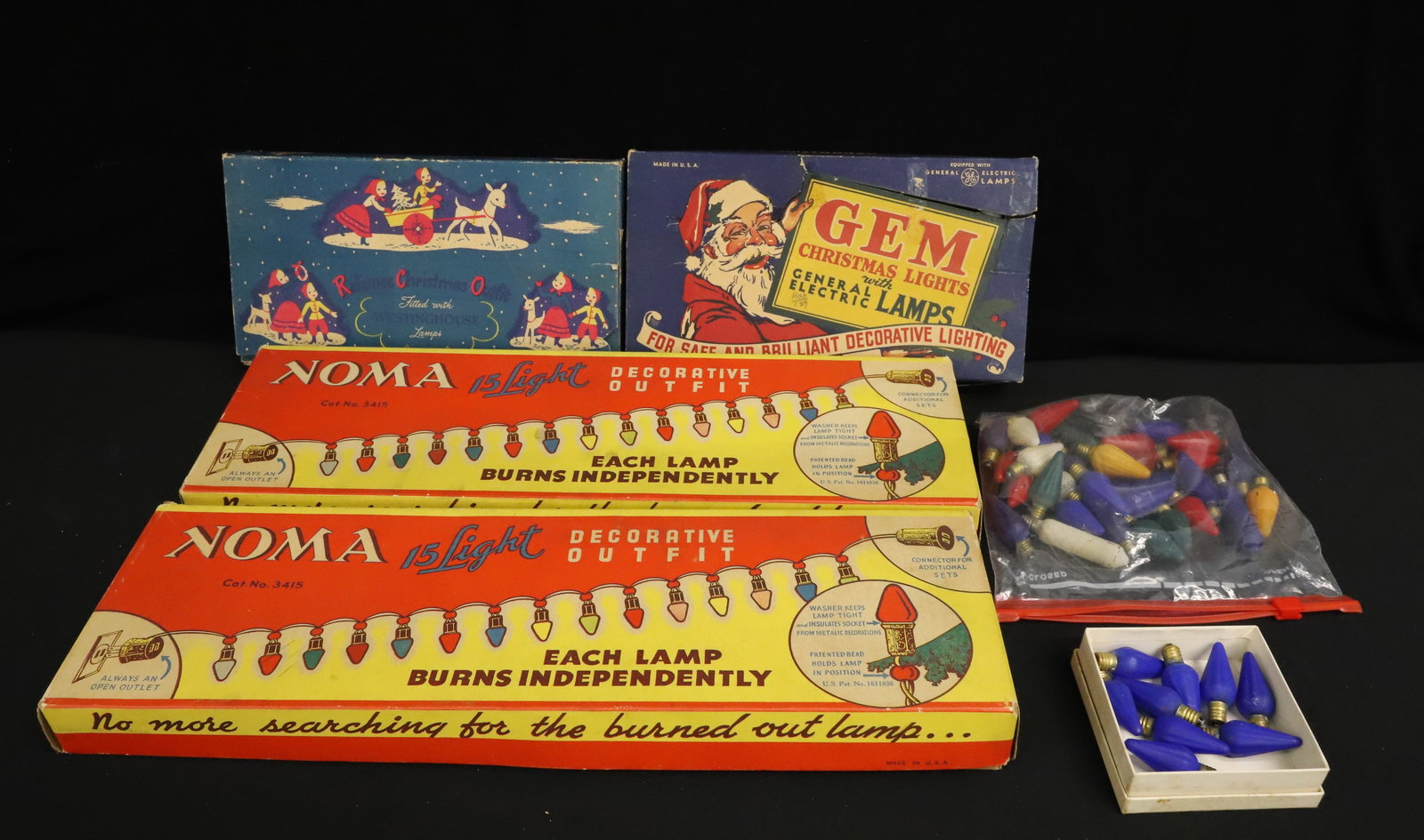 LOT OF VINTAGE CHRISTMAS LIGHTS, DECORATIONS: INCLUDING: (2) NOMA 15 LIGHT STRANDS IN ORIGINAL BOXES 18 1/4" L. GEM LIGHTING SET (GE), RELIANCE CHRISTMAS OUTFIT (WESTINGHOUSE) AND SPARE BULBS. ALL UNTESTED. PLEASE READ CAREFULLY - ITEMS