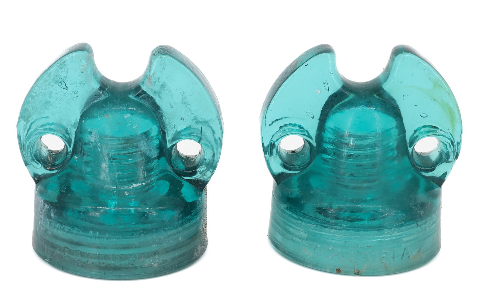 (2) COLUMBIA GLASS INSULATORS, PAT'D 1891: EMBOSSED ON FRONT "PAT'D MAY 12 1891...COLUMBIA". 4 3/4" X 4 1/2". PLEASE READ CAREFULLY - ITEMS MUST BE PAID FOR THROUGH LIVE AUCTIONEERS OR WITH CASH OR CHECK IN PERSON - Terms for Purchasing