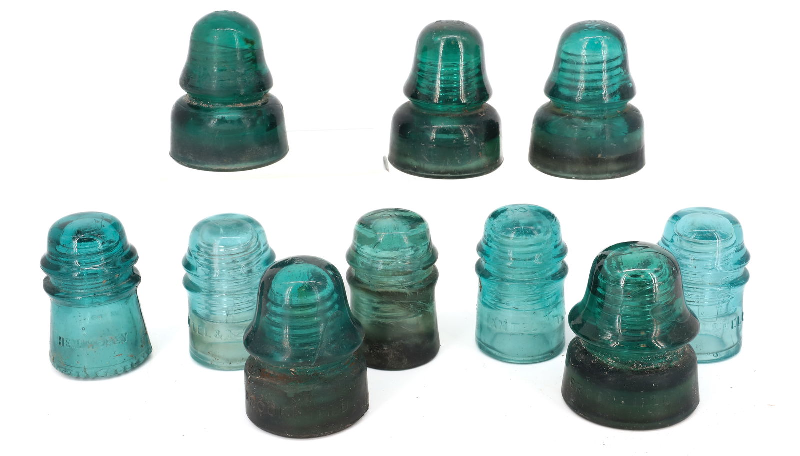 LOT OF (10) GLASS INSULATORS: INCLUDING: (3) PENNSYLVANIA RAILROAD (PRR ON TOP), (2) BROOKFIELD, (4) AM TEL & TEL CO. AND (1) HEMINGRAY NO. 16. LARGEST 4 1/8" X 3 1/4". PLEASE READ CAREFULLY - ITEMS MUST BE PAID FOR THROUGH