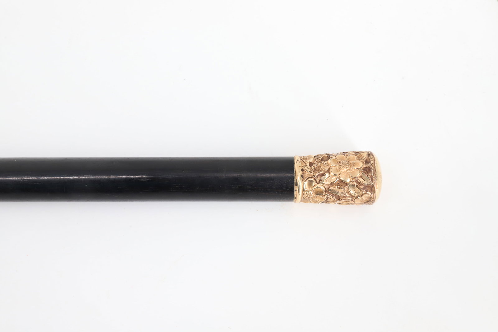 DECORATED GOLD TOP WALKING STICK: NICELY DECORATED WITH DRAGONFLY AND FLOWERS. MRKD. "T&M" EBONY SHAFT. 34 1/4" L. PLEASE READ CAREFULLY - ITEMS MUST BE PAID FOR THROUGH LIVE AUCTIONEERS OR WITH CASH OR CHECK IN PERSON - Terms for Pur