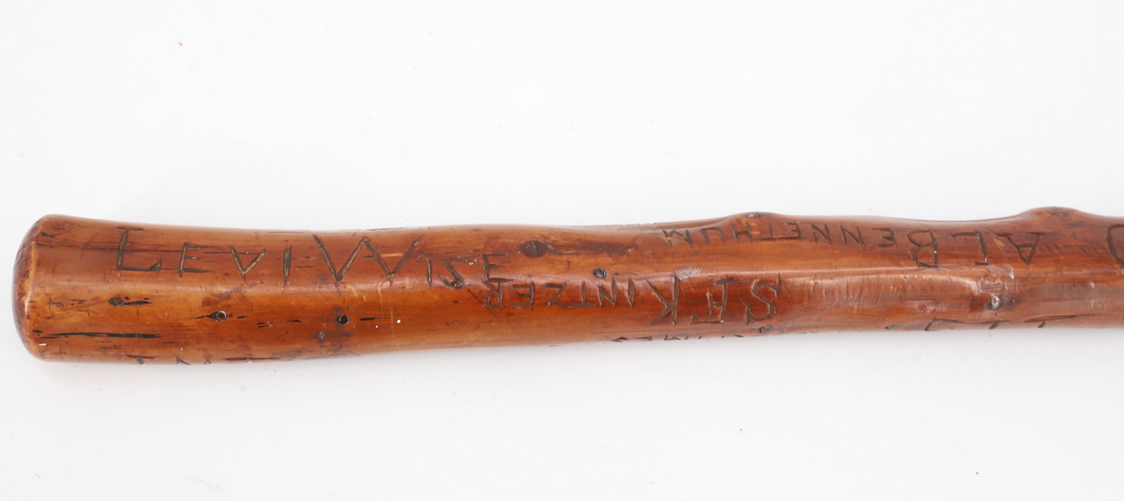 CARVED CENTENNIAL "AUTOGRAPH" WALKING STICK: CARVED WOOD WITH "CENTENNIAL 1876" AND 1877 DATES CARVED. WITH, (15+) NAMES CARVED ON SHAFT. 37 1/2". PLEASE READ CAREFULLY - ITEMS MUST BE PAID FOR THROUGH LIVE AUCTIONEERS OR WITH CASH OR