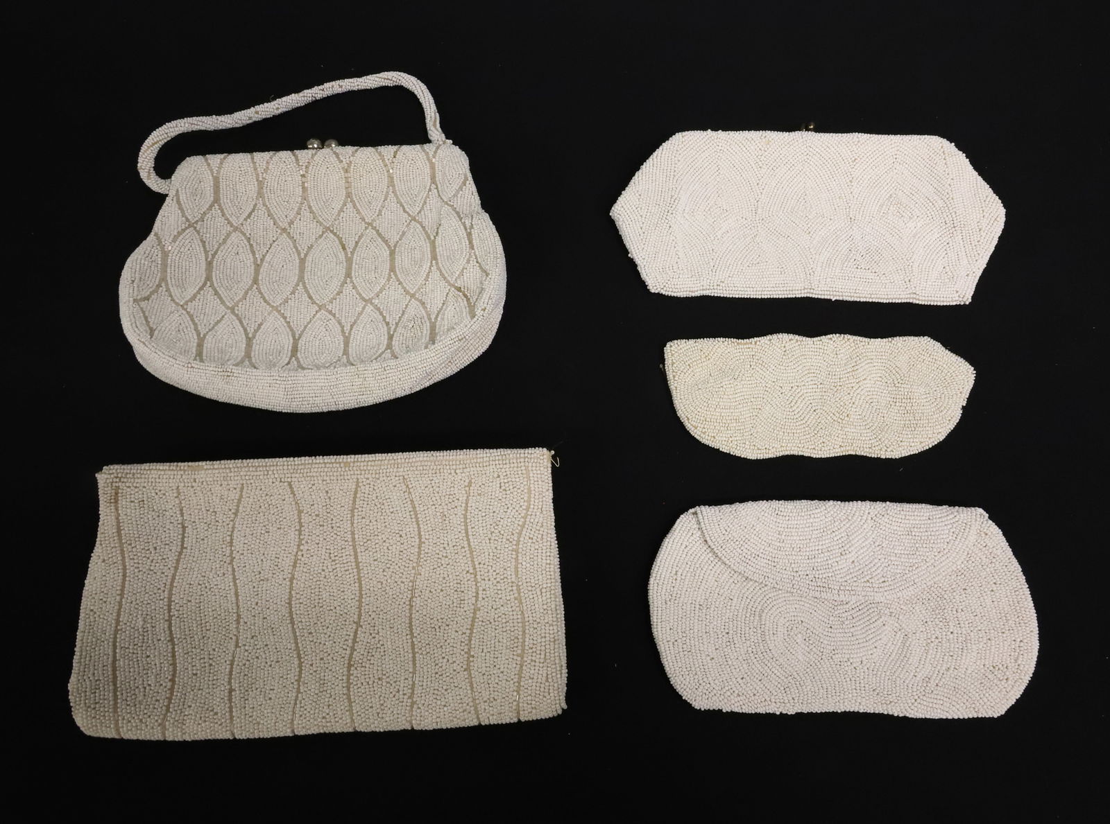LOT OF WHITE BEADED BAGS, PURSES: LARGEST MRKD. JOSEF, BEADED IN JAPAN. 9" L. BAG W/ HANDLE 6" X 8" (SOME DISCOLOR TO LINING), TWO SMALLER "MADE IN BELGIUM". EYEGLASS CASE UNMARKED. PLEASE READ CAREFULLY - ITEMS MUST BE PAID FOR