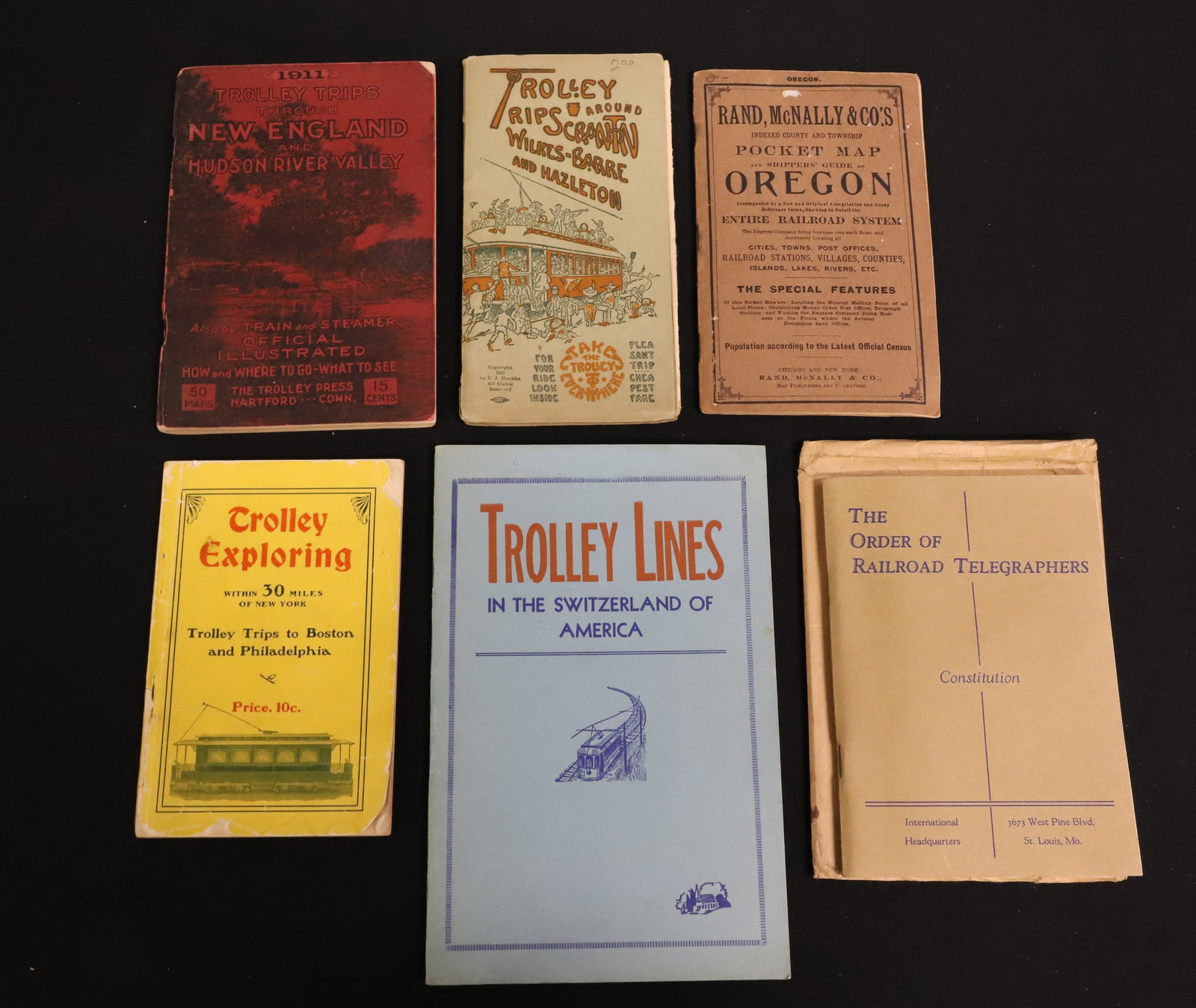 LOT OF ANTIQUE RAILROAD AND TROLLEY PAPER GOODS: INCLUDING: 1902 TROLLEY EXPLORING, 1906 RAND, MCNALLY POCKET MAP OF OREGON, 1911 TROLLEY TRIPS THROUGH NEW ENGLAND AND HUDSON RIVER VALLEY, 1913 TROLLEY TRIPS AROUND SCRANTON, WILKES-BARRE AND