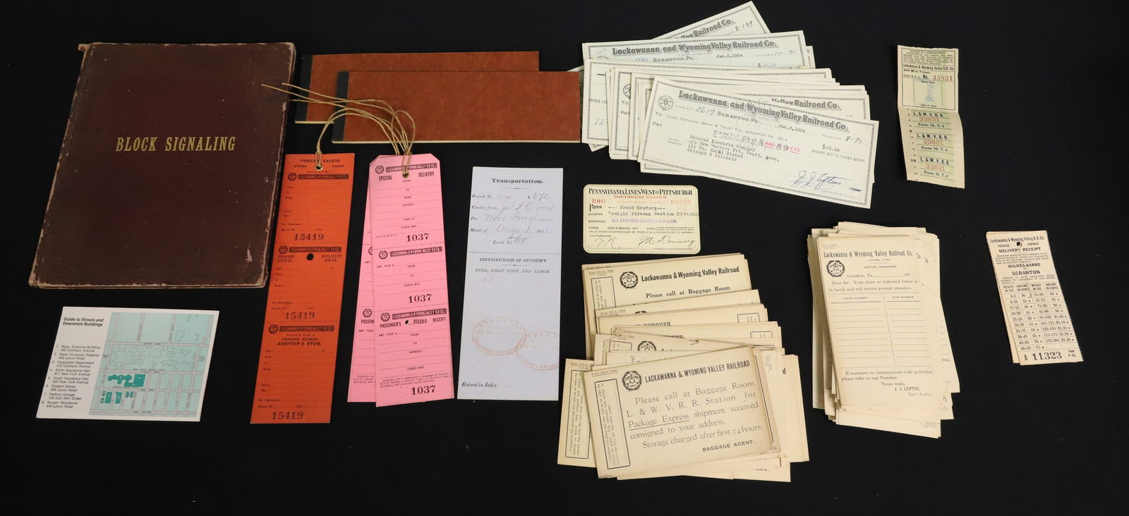 LOT OF ANTIQUE RAILROAD PAPER GOODS: INCLUDING: 1891 BLOCK SIGNALING BOOK, LACKAWANNA/WYOMING EMPLOYEE TRIP TICKET PADS, LACKAWANNA AND WYOMING VALLEY RAILROAD CANCELLED CHECKS, HANG TAGS AND MORE. PLEASE READ CAREFULLY - ITEMS MUST