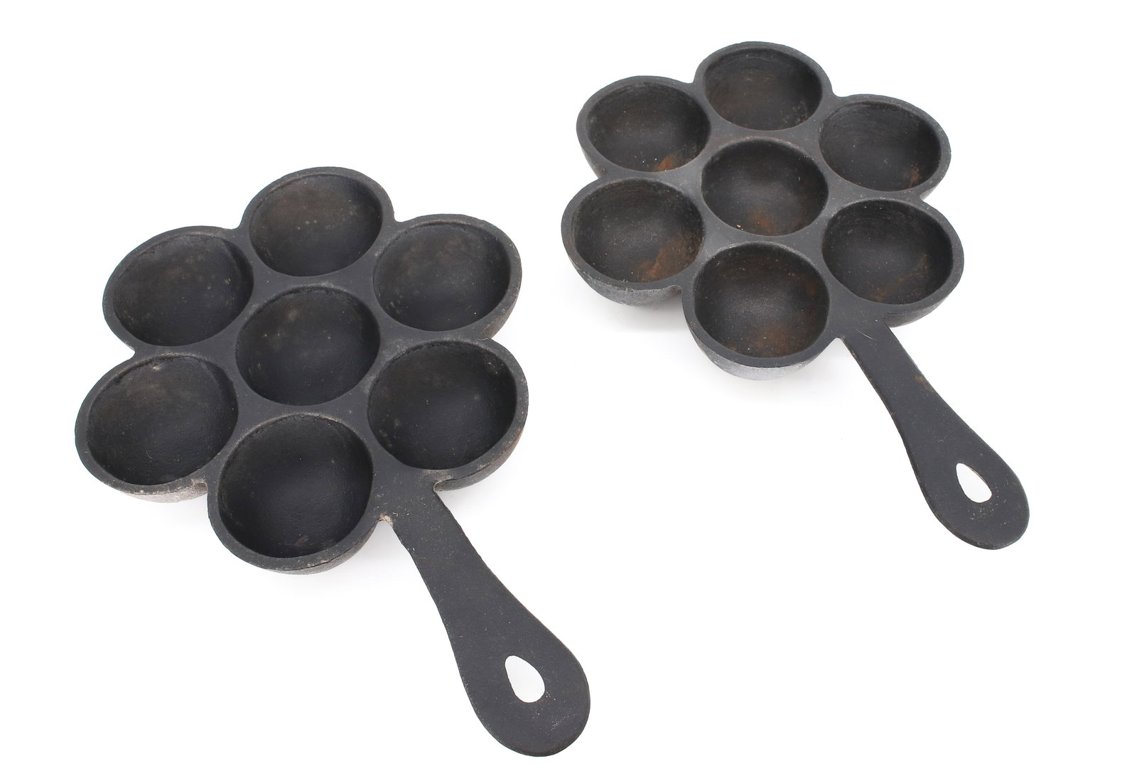(2) CAST IRON AEBLESKIVER PANS, SKILLETS: 10 3/4" X 7 3/8". UNMARKED. PLEASE READ CAREFULLY - ITEMS MUST BE PAID FOR THROUGH LIVE AUCTIONEERS OR WITH CASH OR CHECK IN PERSON - Terms for Purchasing and Shipping of Auction Items. Please
