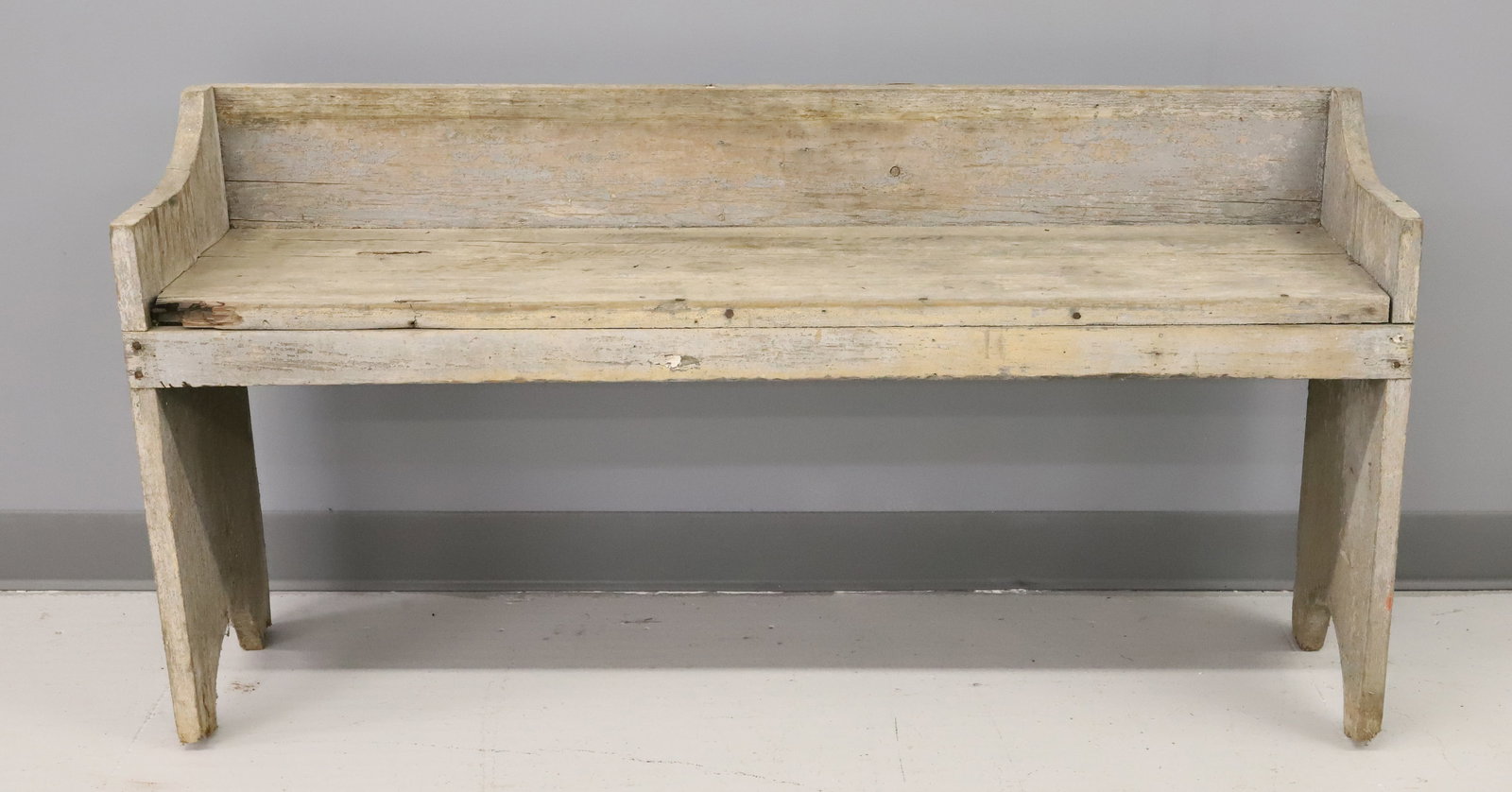 COUNTRY PORCH BENCH: TRACES OF ORIGINAL GRAY PAINT. HALF-MOON CUT-OUTS ON ENDS. 24" X 47 3/4" X 12 3/4". PLEASE READ CAREFULLY - ITEMS MUST BE PAID FOR THROUGH LIVE AUCTIONEERS OR WITH CASH OR CHECK IN PERSON -