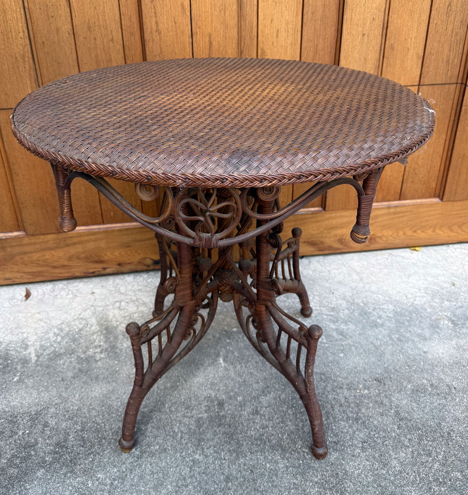 HEYWOOD BROTHERS WICKER TABLE: 29 1/2" X 30" D. LABELED UNDERNEATH. PLEASE READ CAREFULLY - ITEMS MUST BE PAID FOR THROUGH LIVE AUCTIONEERS OR WITH CASH OR CHECK IN PERSON - Terms for Purchasing and Shipping of Auction Items.