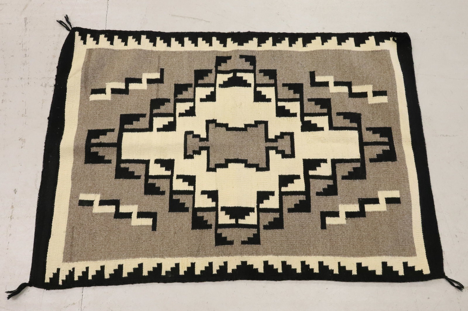 VINTAGE NAVAJO RUG: TWO GREY HILLS-STYLE DESIGN. 40" X 28". PLEASE READ CAREFULLY - ITEMS MUST BE PAID FOR THROUGH LIVE AUCTIONEERS OR WITH CASH OR CHECK IN PERSON - Terms for Purchasing and Shipping of Auction