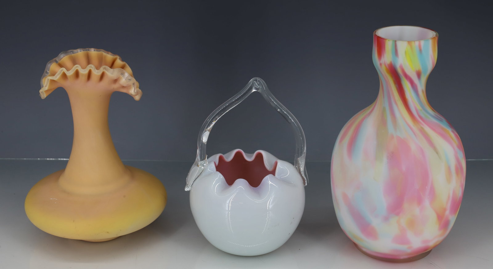 (3) VICTORIAN ART GLASS: PASTEL CASED END OF DAY CARAGE, BLOWN YELLOW TO BEIGE OPAQUE GLASS WITH RUFFLED CLEAR RIM GROUND PONTIL AND CASED HANDLED ROSE BOWL APPLIED CLEAR HANDLE 6" TO 7 1/4"H PLEASE READ CAREFULLY - ITEMS MUS