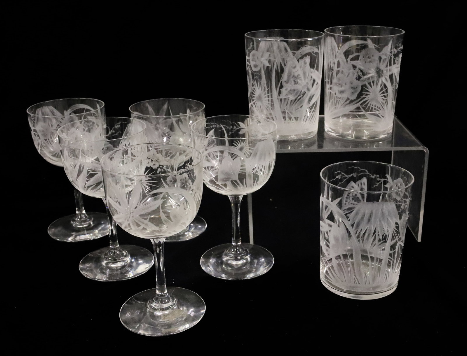 (8) DORFLINGER KALANA LINE STEMWARE: ALL MATCHING , PATTERN OF BUTTERFLY, PALMS AND FLORAL (5) WINES (3) TUMBLERS 3 1/2"H, 4 3/4"H PLEASE READ CAREFULLY - ITEMS MUST BE PAID FOR THROUGH LIVE AUCTIONEERS OR WITH CASH OR CHECK IN PERSON -