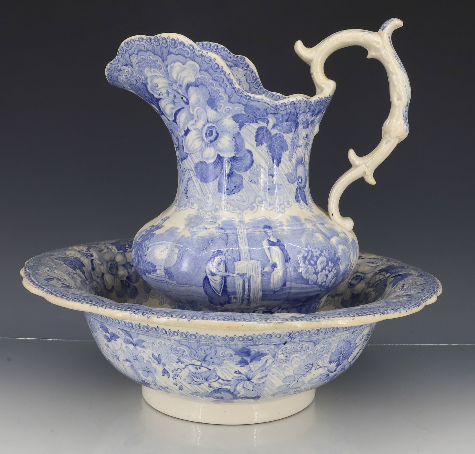 ENGLISH TRANSFERWARE PITCHER AND BOWL: TRANSFER OF FLORAL WITH TWO MAIDS AT A FOUNTAIN, 1840S 10 1/2" X 9 1/2", 4" X 13"DIA PLEASE READ CAREFULLY - ITEMS MUST BE PAID FOR THROUGH LIVE AUCTIONEERS OR WITH CASH OR CHECK IN PERSON -