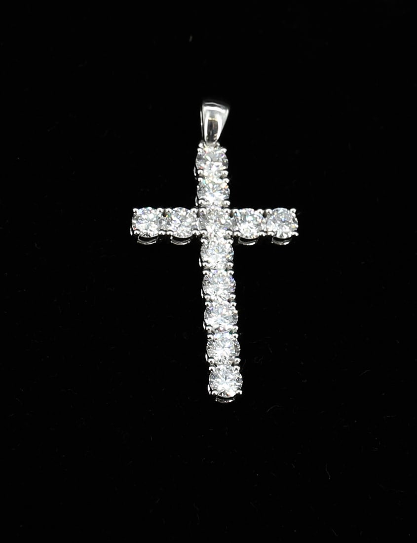 14K WHITE GOLD AND DIAMOND CROSS PENDANT: (12) DIAMONDS TOTALING 1.94 CT. TOTAL WEIGHT 1.35 DWT 1 1/2" X 3/4" PLEASE READ CAREFULLY - ITEMS MUST BE PAID FOR THROUGH LIVE AUCTIONEERS OR WITH CASH OR CHECK IN PERSON - Terms for Purchasing