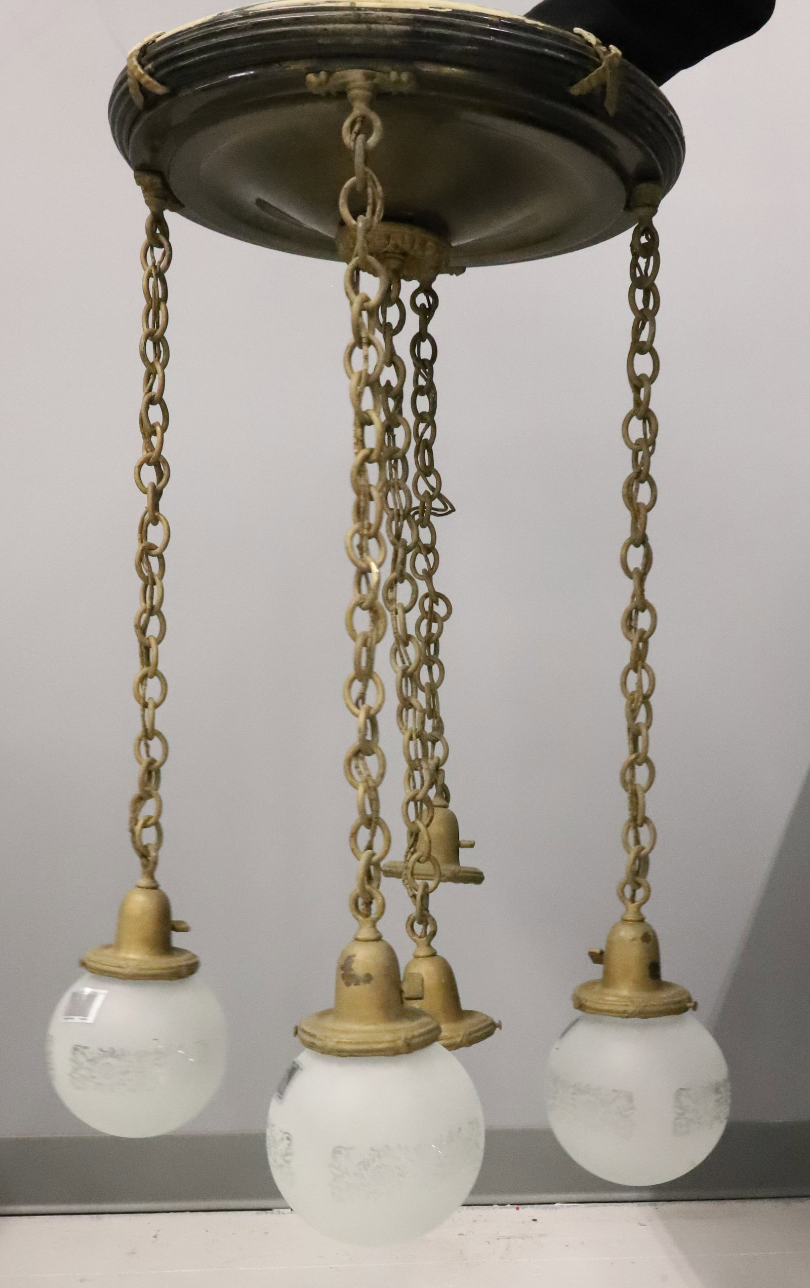 1930S FLUSH MOUNT CHANDELIER: FIVE DROP LIGHTS ON IRON CHAINS INCLUDED FOUR FROSTED BALL SHADES FITTER RINGS 3 3/8" 30"L X 17" DIA PLEASE READ CAREFULLY - ITEMS MUST BE PAID FOR THROUGH LIVE AUCTIONEERS OR WITH CASH OR CHECK IN PE