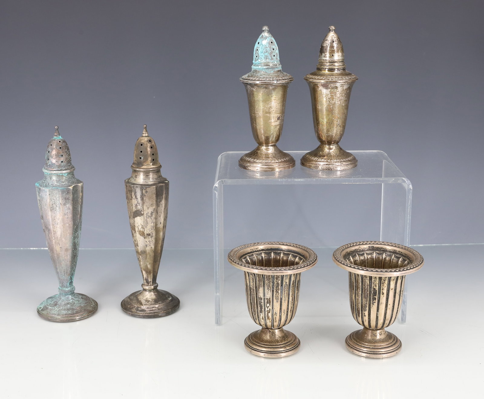 (6) STERLING SILVER WEIGHTED HOLLOWARE: TWO PAIR SHAKERS, TWO CIGARETTE CADDIES 3" TO 6" PLEASE READ CAREFULLY - ITEMS MUST BE PAID FOR THROUGH LIVE AUCTIONEERS OR WITH CASH OR CHECK IN PERSON - Terms for Purchasing and Shipping of