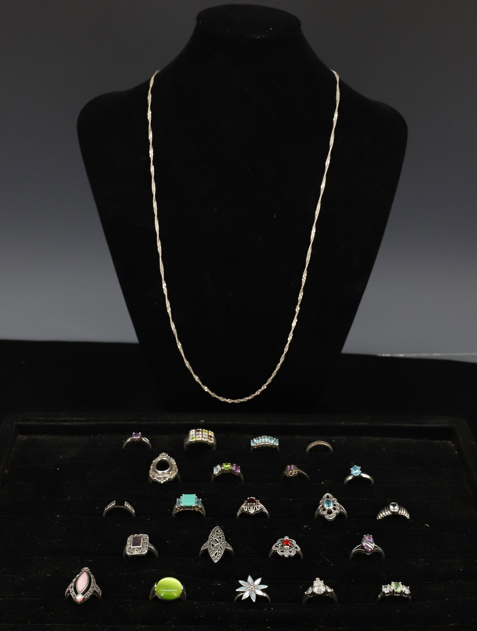 STERLING SILVER RINGS: (22) RINGS SIZES 5 TO 9 NECK CHAIN 28" TOTAL WEIGHT 2.8 OZT PLEASE READ CAREFULLY - ITEMS MUST BE PAID FOR THROUGH LIVE AUCTIONEERS OR WITH CASH OR CHECK IN PERSON - Terms for Purchasing and Shipping