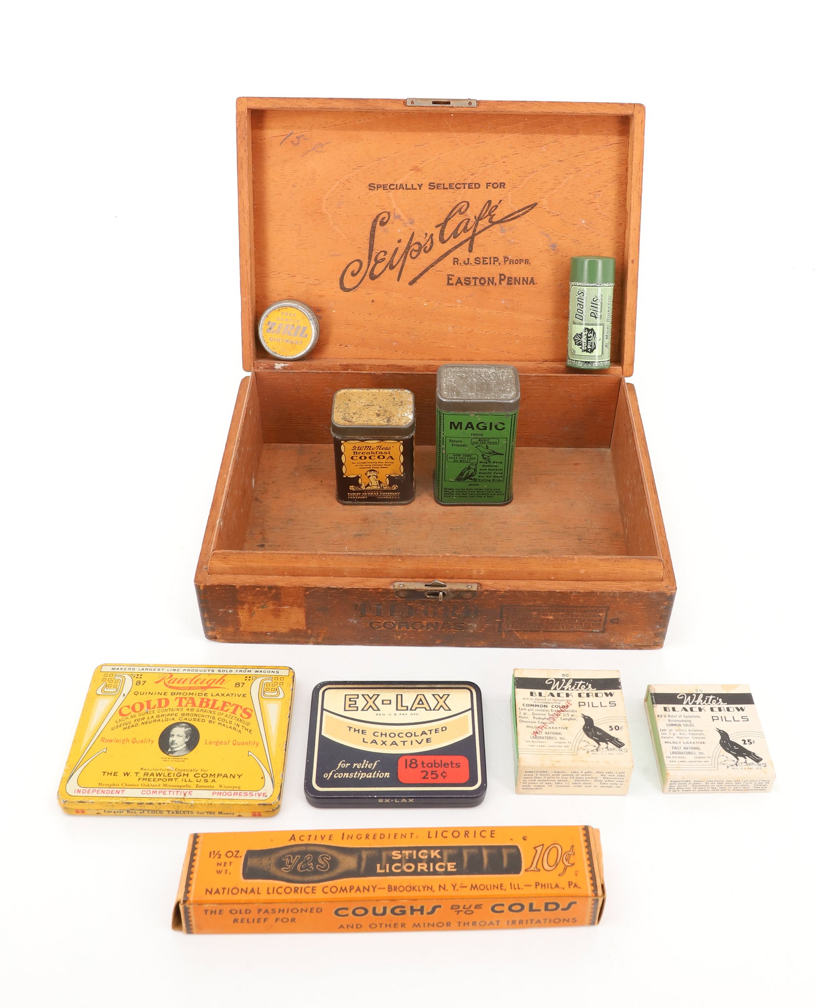 LOT OF ADVERTISING TINS: PAPER AND TIN LITHO CONTAINERS WITH "SEIP'S CAFE, EASTON, PA" WOODEN BOX 9" L. INCLUDING: MAGIC BIRD FOOD, COCOA, EX-LAX, RAWLEIGH COLD TABLETS, WHITE'S BLACK CROW PILLS AND MORE. PLEASE READ