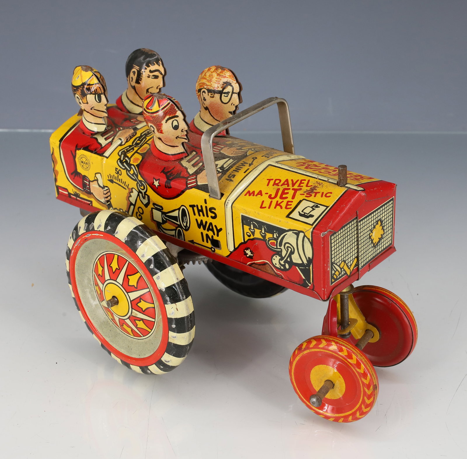 MARX "THE OLD JALOPY" WIND-UP CAR: TIN LITHO CAR WITH FOUR FIGURES. 5 1/2" L. WORKING ORDER. PLEASE READ CAREFULLY - ITEMS MUST BE PAID FOR THROUGH LIVE AUCTIONEERS OR WITH CASH OR CHECK IN PERSON - Terms for Purchasing and