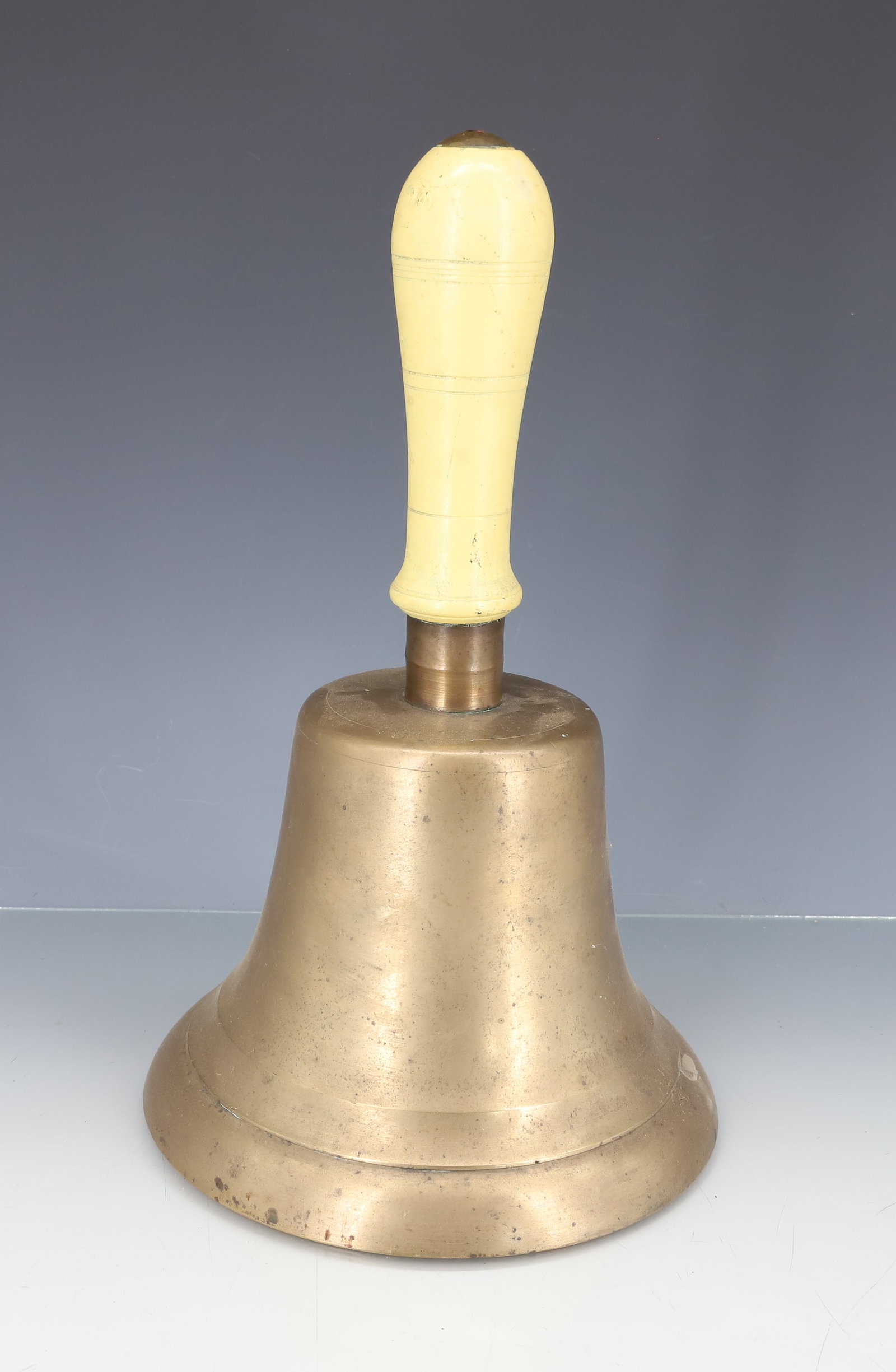 LARGE BRASS SCHOOL BELL: PAINTED WOODEN HANDLE. 10 1/4" X 6 1/2". PLEASE READ CAREFULLY - ITEMS MUST BE PAID FOR THROUGH LIVE AUCTIONEERS OR WITH CASH OR CHECK IN PERSON - Terms for Purchasing and Shipping of Auction Items. P