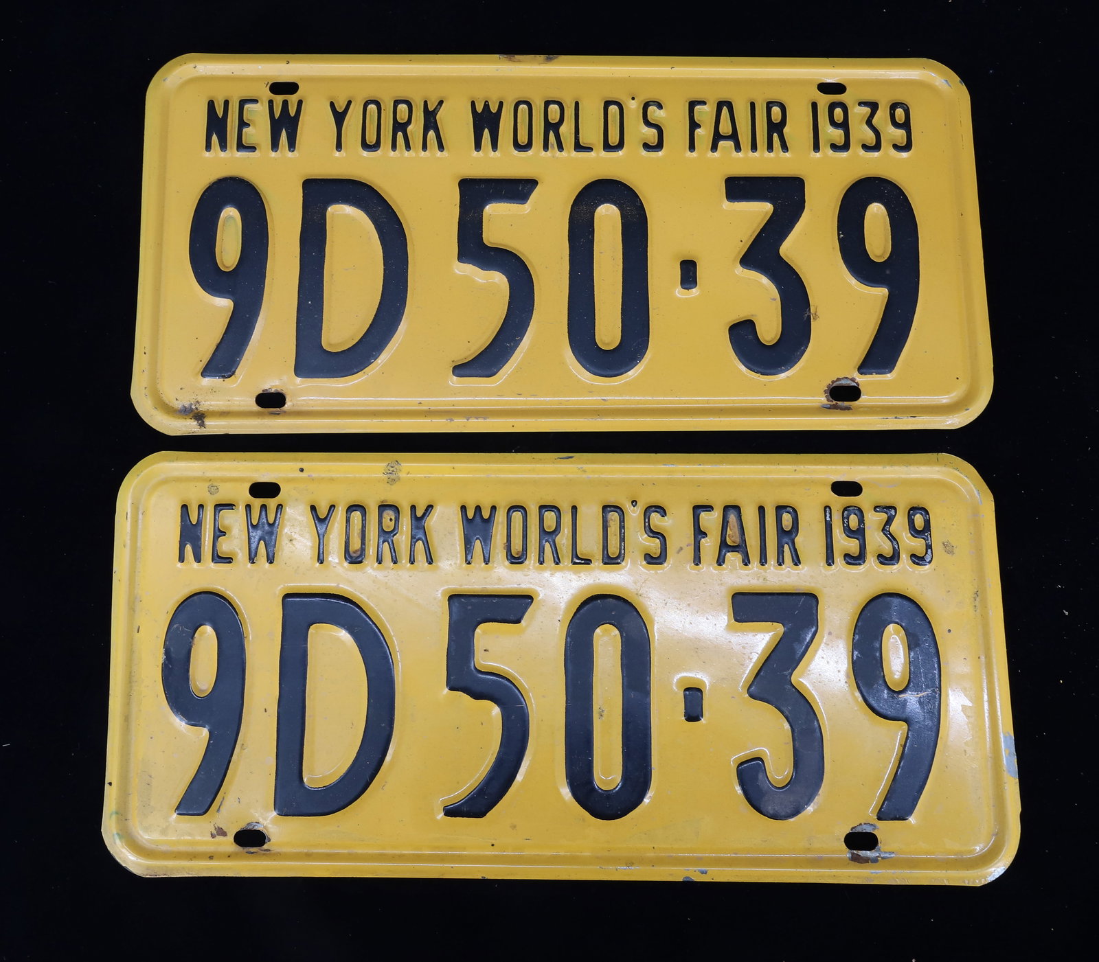 PAIR OF 1939 NY WORLD'S FAIR LICENSE PLATES: 13 1/2" L. PLEASE READ CAREFULLY - ITEMS MUST BE PAID FOR THROUGH LIVE AUCTIONEERS OR WITH CASH OR CHECK IN PERSON - Terms for Purchasing and Shipping of Auction Items. Please read carefully before bi