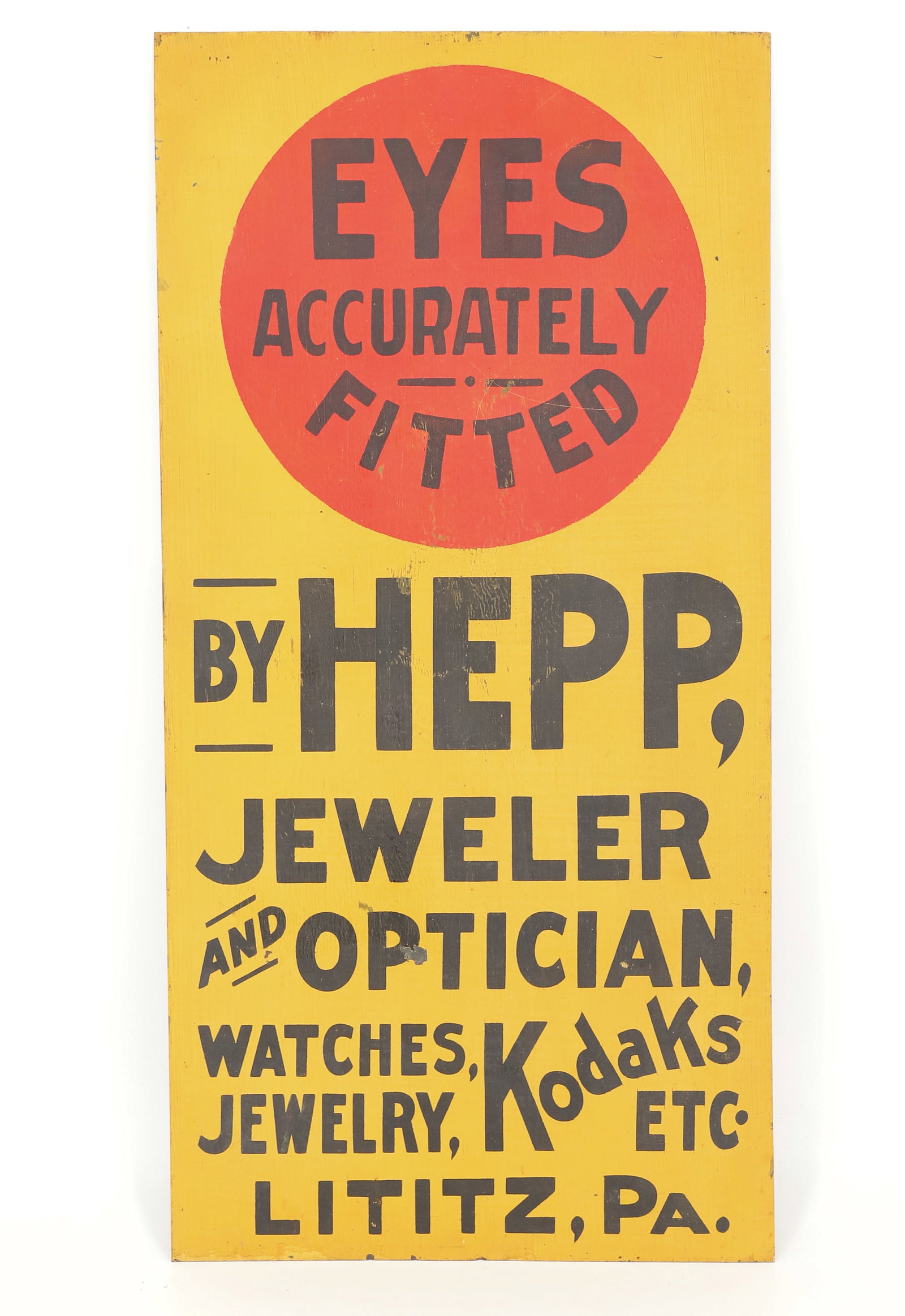 PAINTED METAL ADVERTISING SIGN, LITITZ, PA: RED / YELLOW / BLACK PAINT ON METAL. "EYES ACCURATELY FITTED, BY HEPP, JEWELER AND OPTICIAN, WATCHES, JEWELRY, KODAKS, ETC." 24 1/4" X 12". PLEASE READ CAREFULLY - ITEMS MUST BE PAID FOR THROUGH LIVE 