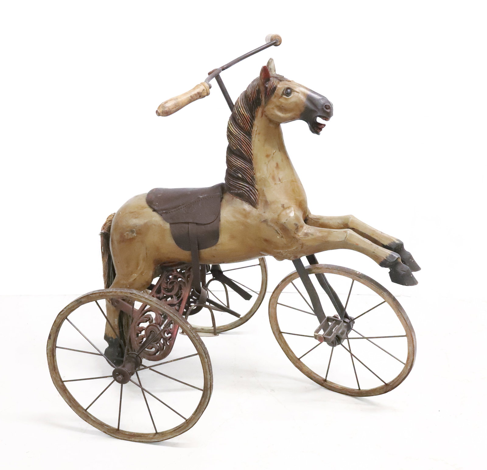 CARVED AND PAINTED HORSE TRICYCLE: CARVED WOOD AND CAST IRON TRICYCLE. 32" X 22" X 32". PLEASE READ CAREFULLY - ITEMS MUST BE PAID FOR THROUGH LIVE AUCTIONEERS OR WITH CASH OR CHECK IN PERSON - Terms for Purchasing and Shipping of