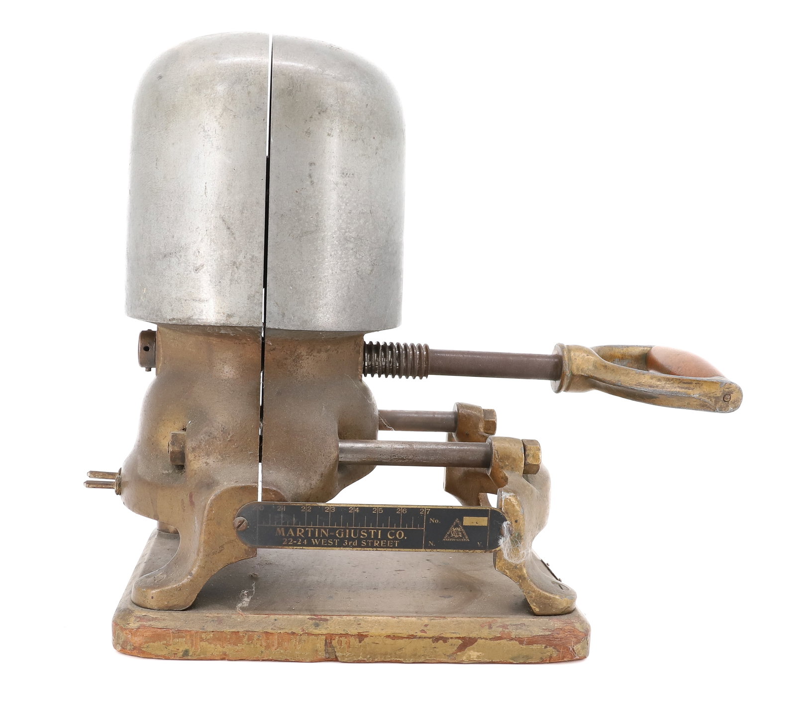 ELECTRIC HAT FORM / MOD: MARTIN-GIUSTI COMPANY. ALUMINUM AND BRASS WITH ADJUSTABLE ROD. MOUNTED ON WOODEN BOARD. 14" X 14". PLEASE READ CAREFULLY - ITEMS MUST BE PAID FOR THROUGH LIVE AUCTIONEERS OR WITH CASH OR CHECK IN